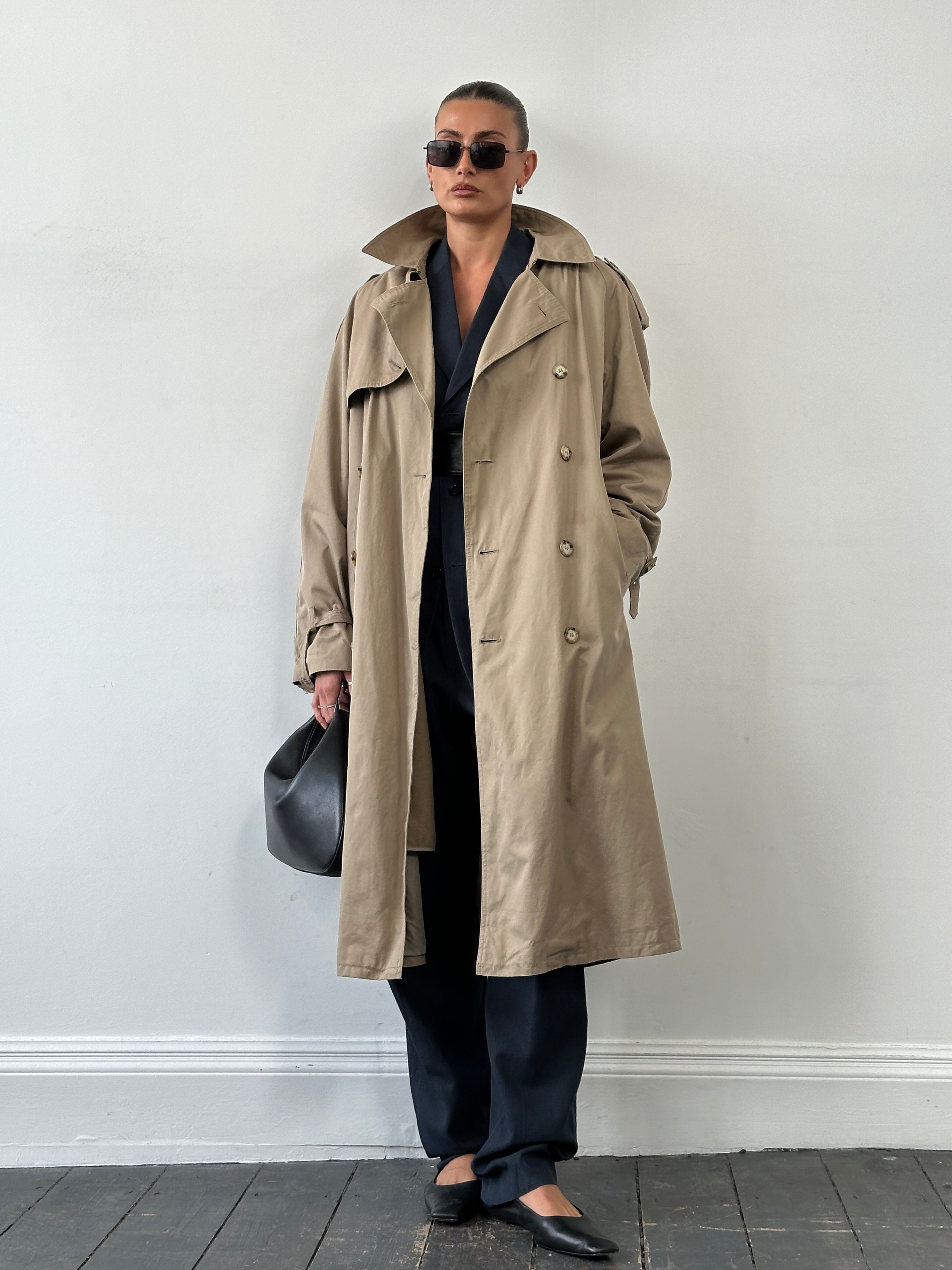 Yves Saint Laurent 80s pure cotton double-breasted belted trench coat in XL, beige color, showing classic design and belted waist.