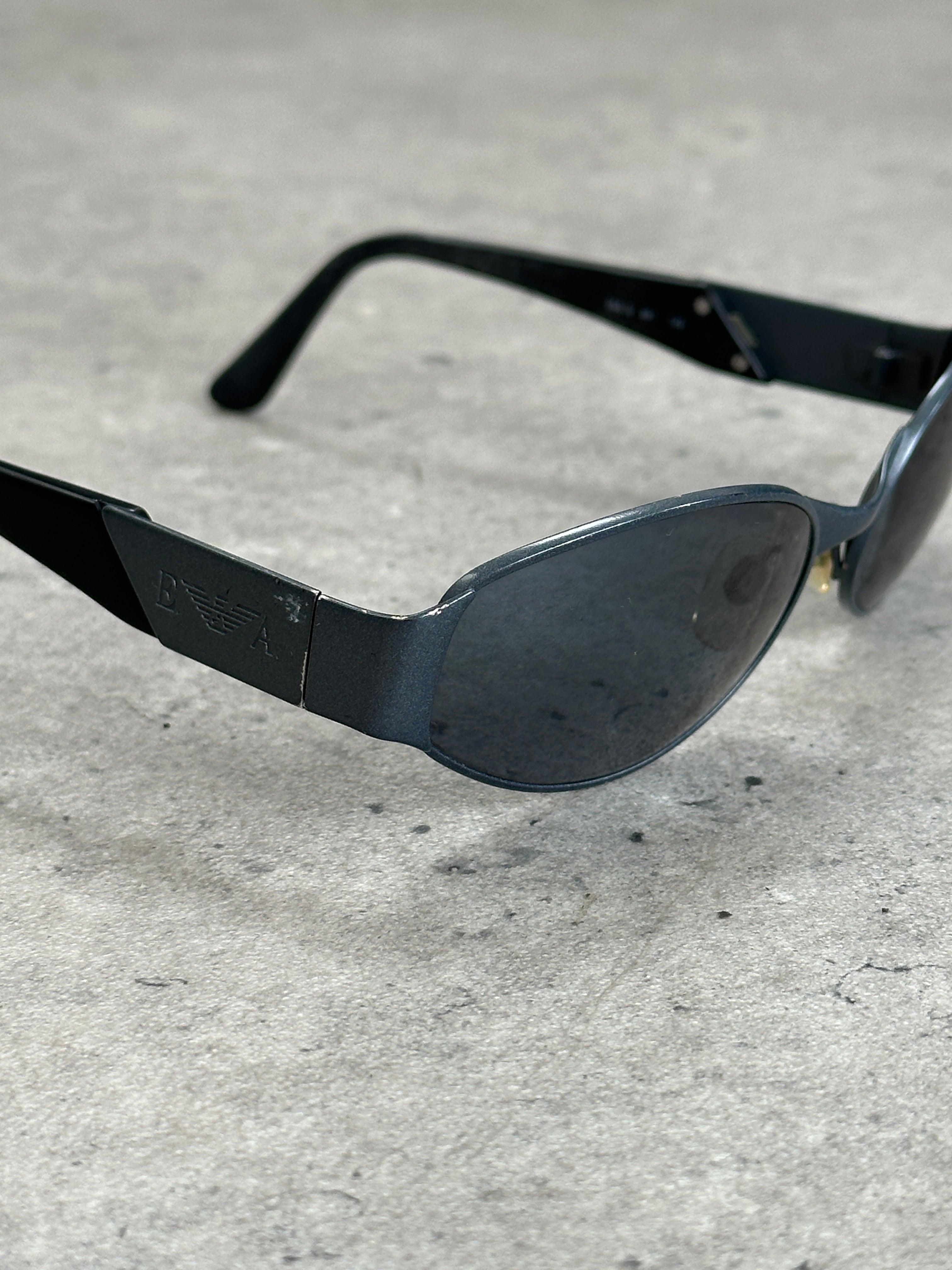Emporio Armani 1990s oval logo sunglasses with black frames and dark lenses, stylish and iconic eyewear design.