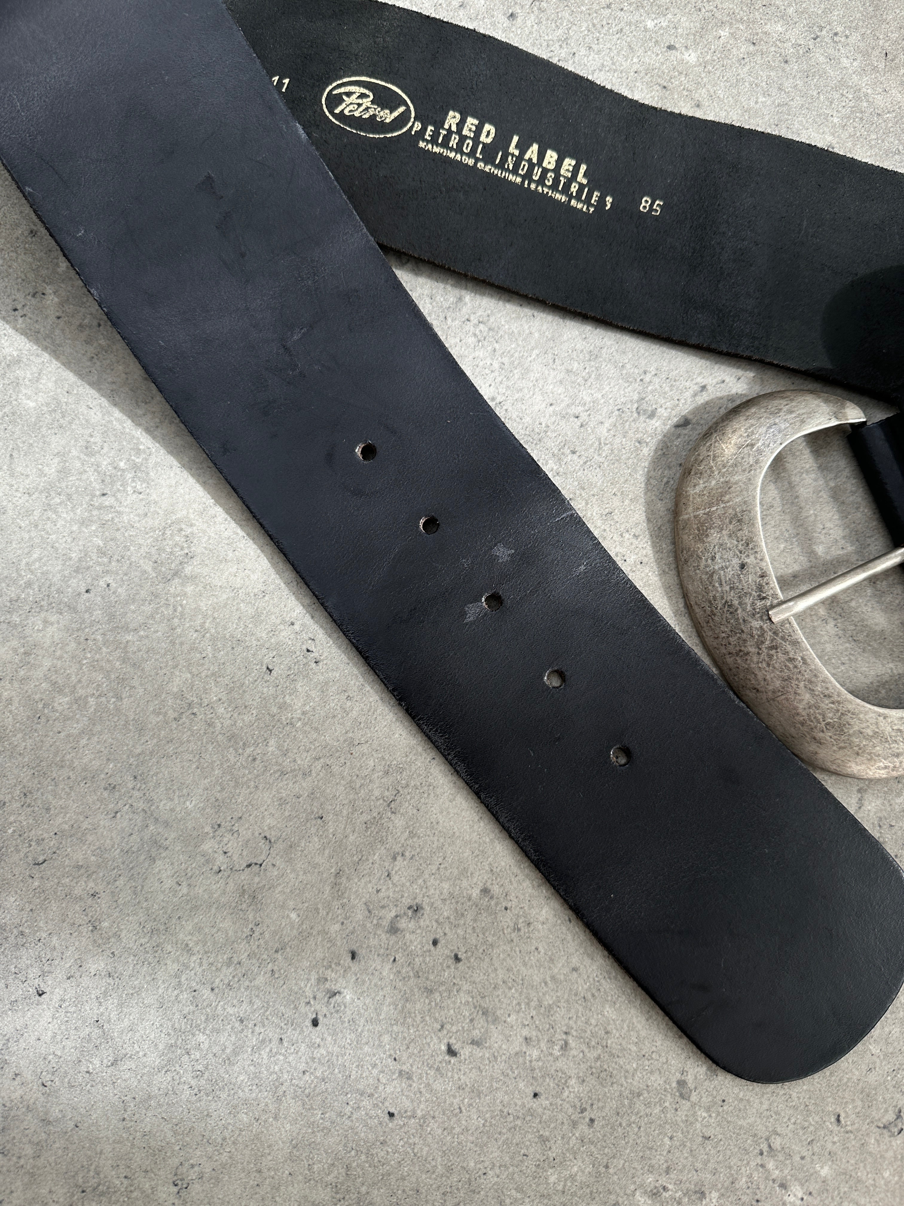 Vintage 1990s chunky leather belt in brown with a large buckle, adjustable W30-34 inches, classic retro accessory.