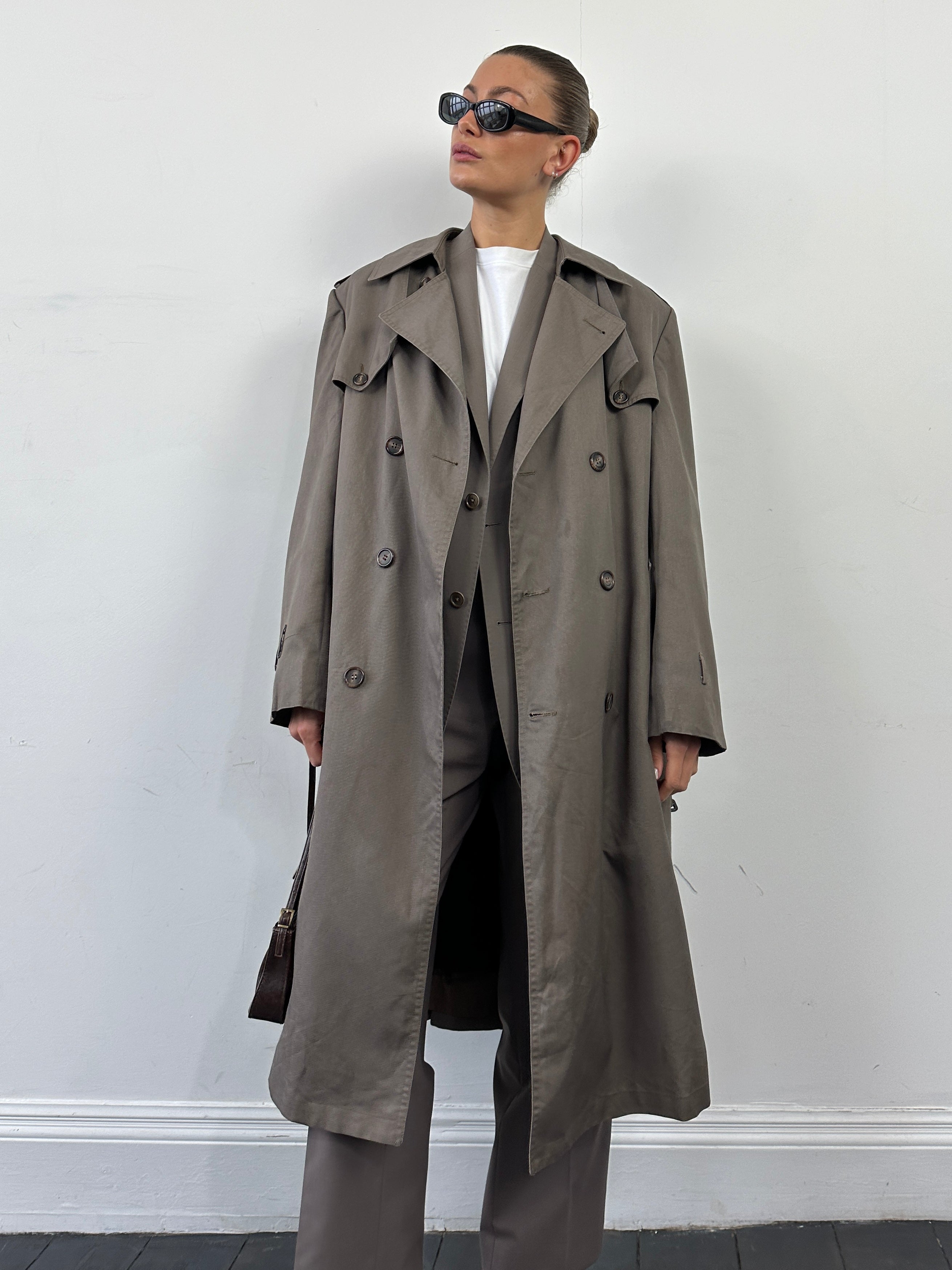 Christian Dior Monsieur double-breasted belted trench coat in XL with classic design and tailored fit, shown on a hanger.