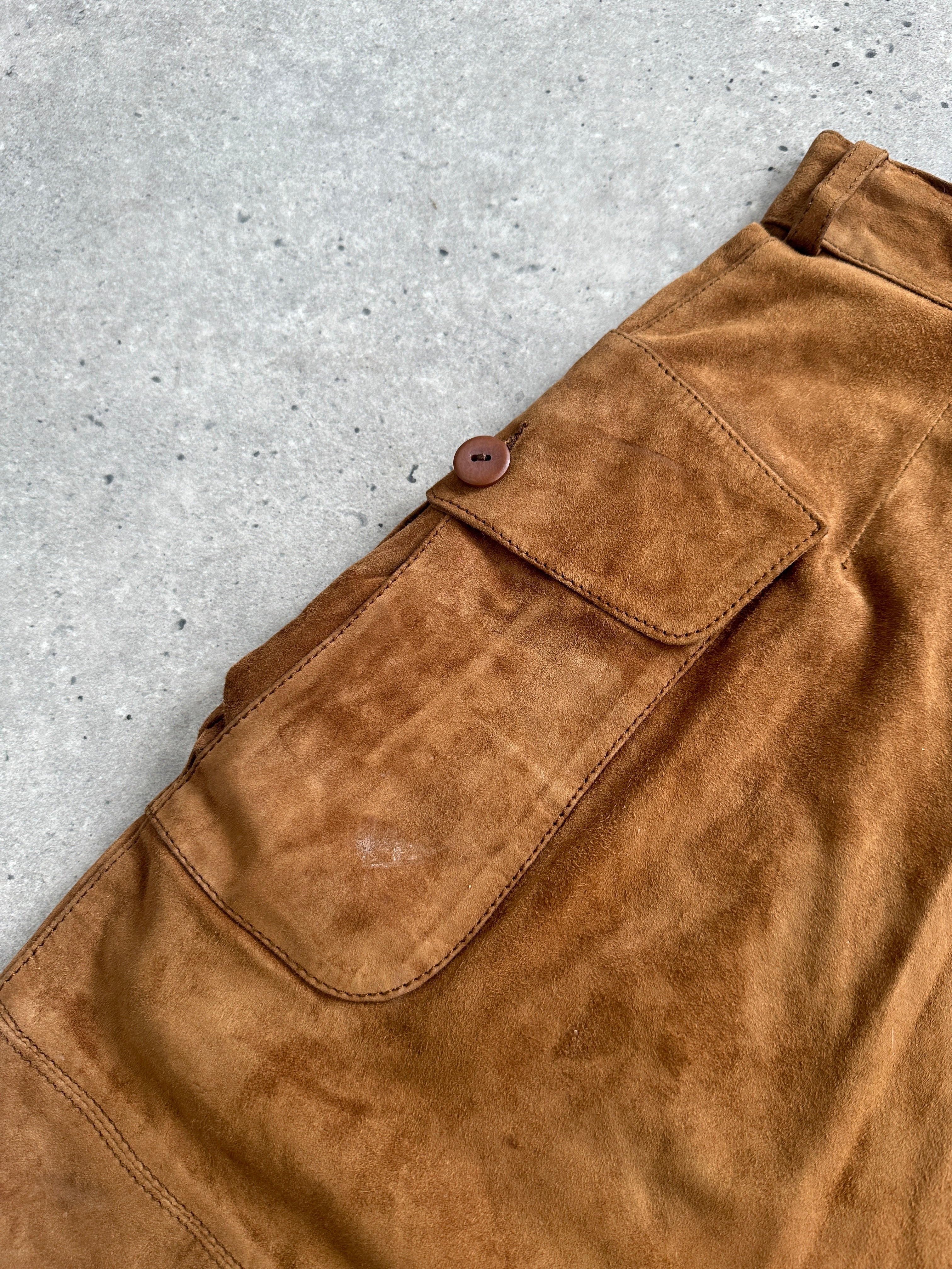 Vintage Italian high waisted suede leather shorts in a rich brown color, showcasing their stylish vintage design and high waist fit.