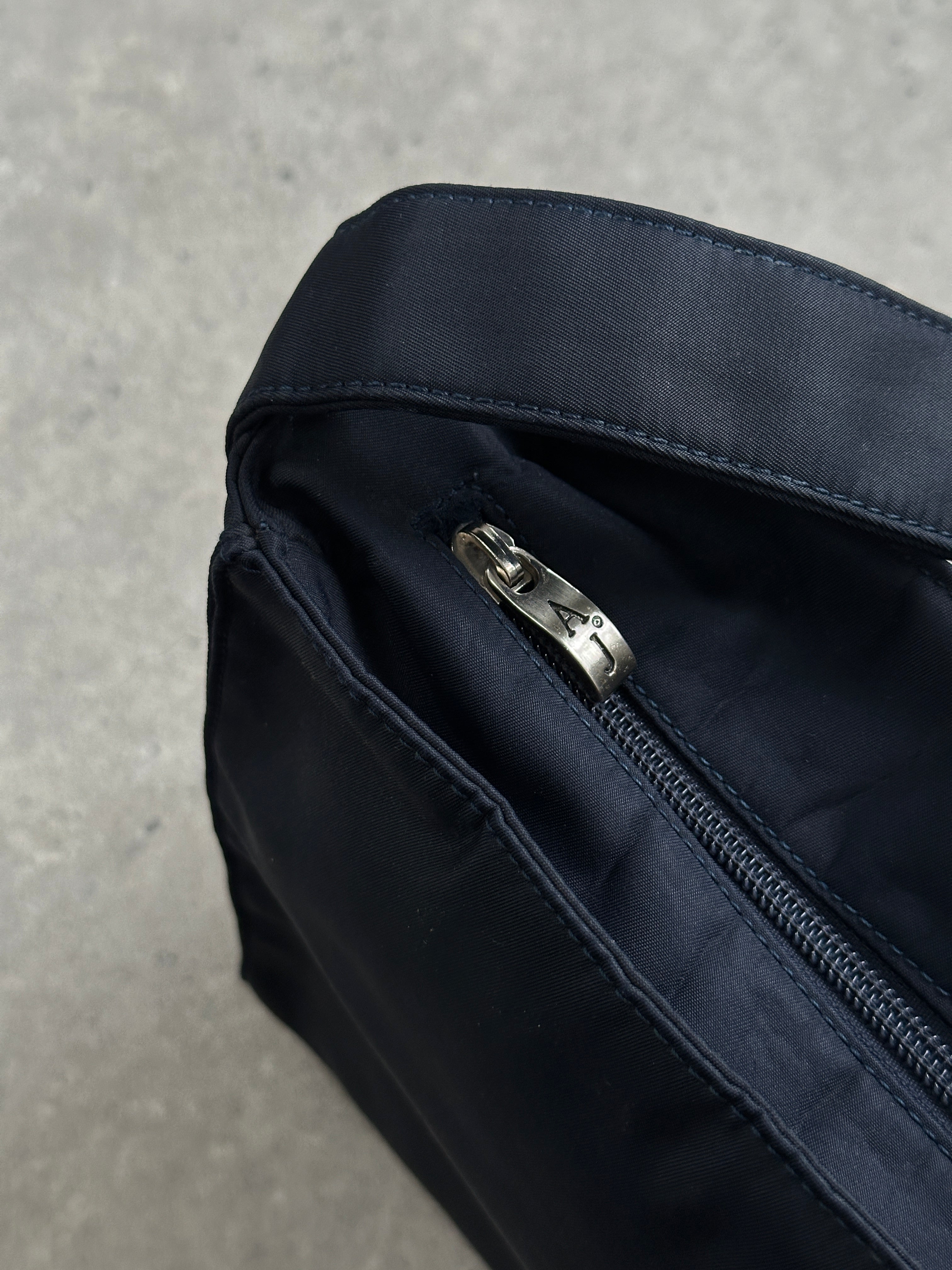 Armani Jeans 2000s nylon shoulder bag with adjustable strap and sleek design, featuring the Armani logo on the front.