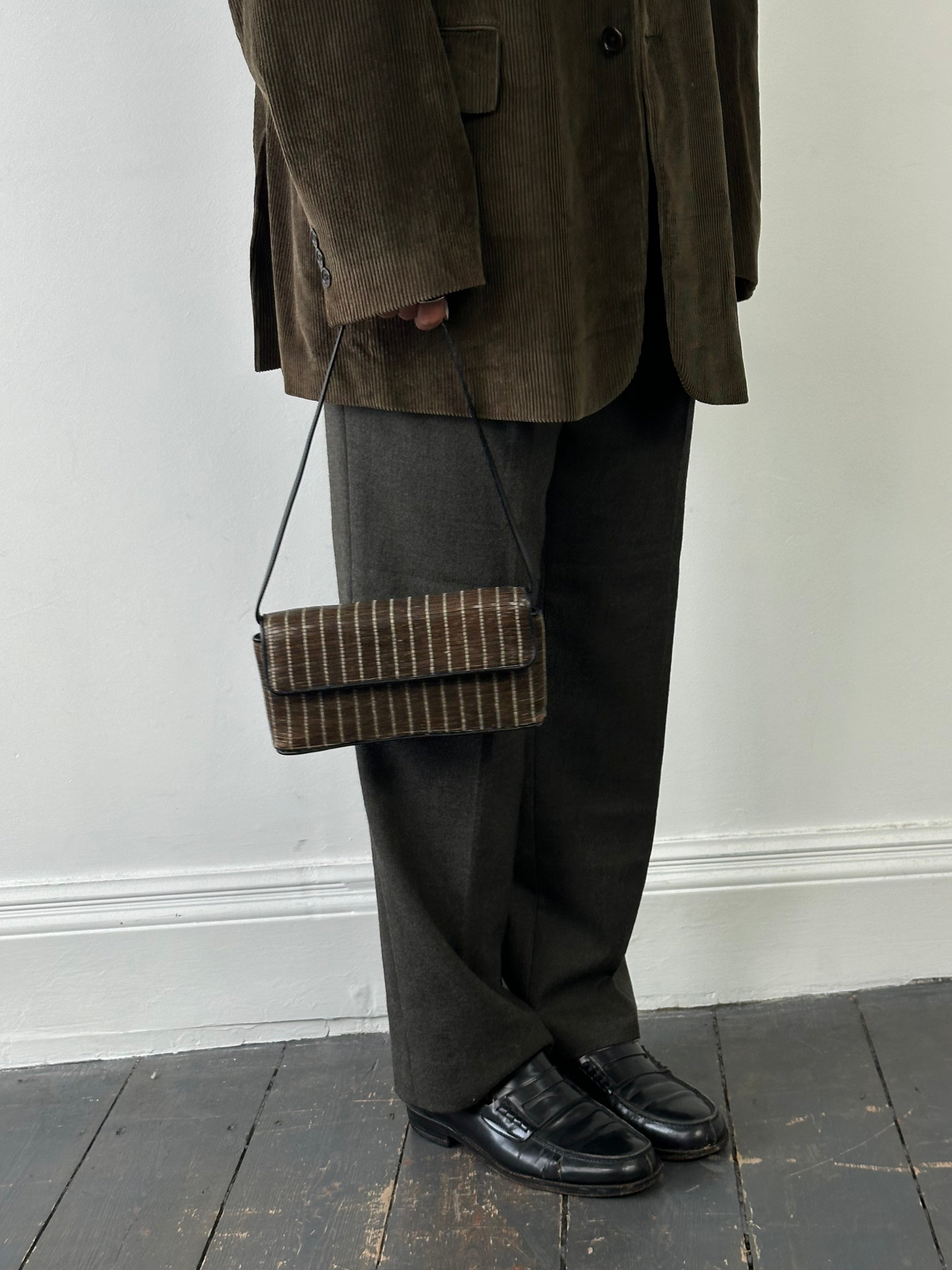 Giorgio Armani leather handbag with sleek design, top handle, and subtle branding, perfect for elegant everyday use.