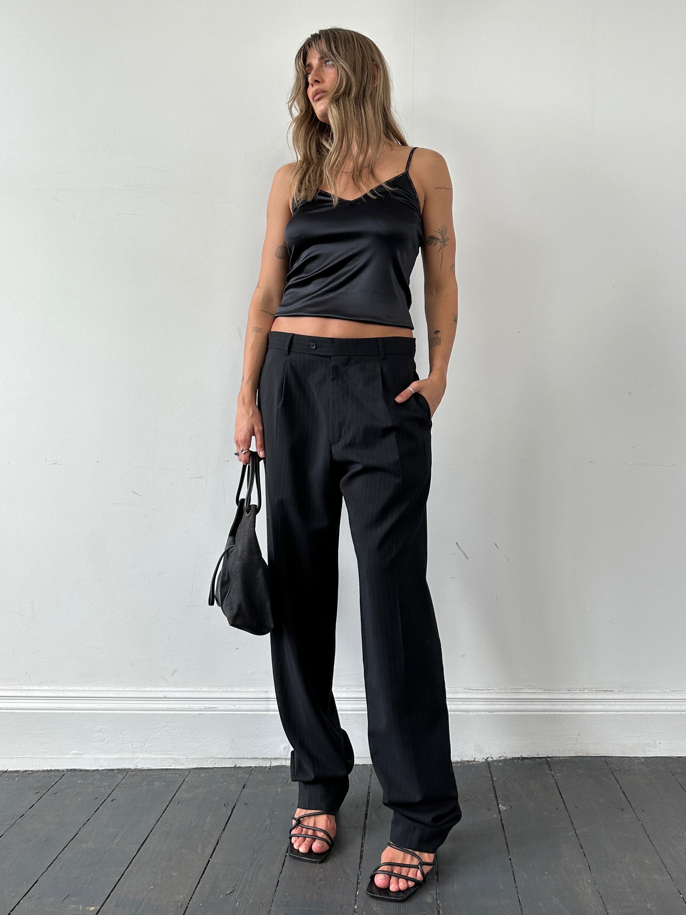 Vintage pinstripe virgin wool tailored tall trousers with pleats, featuring a classic high waist and straight-leg fit.