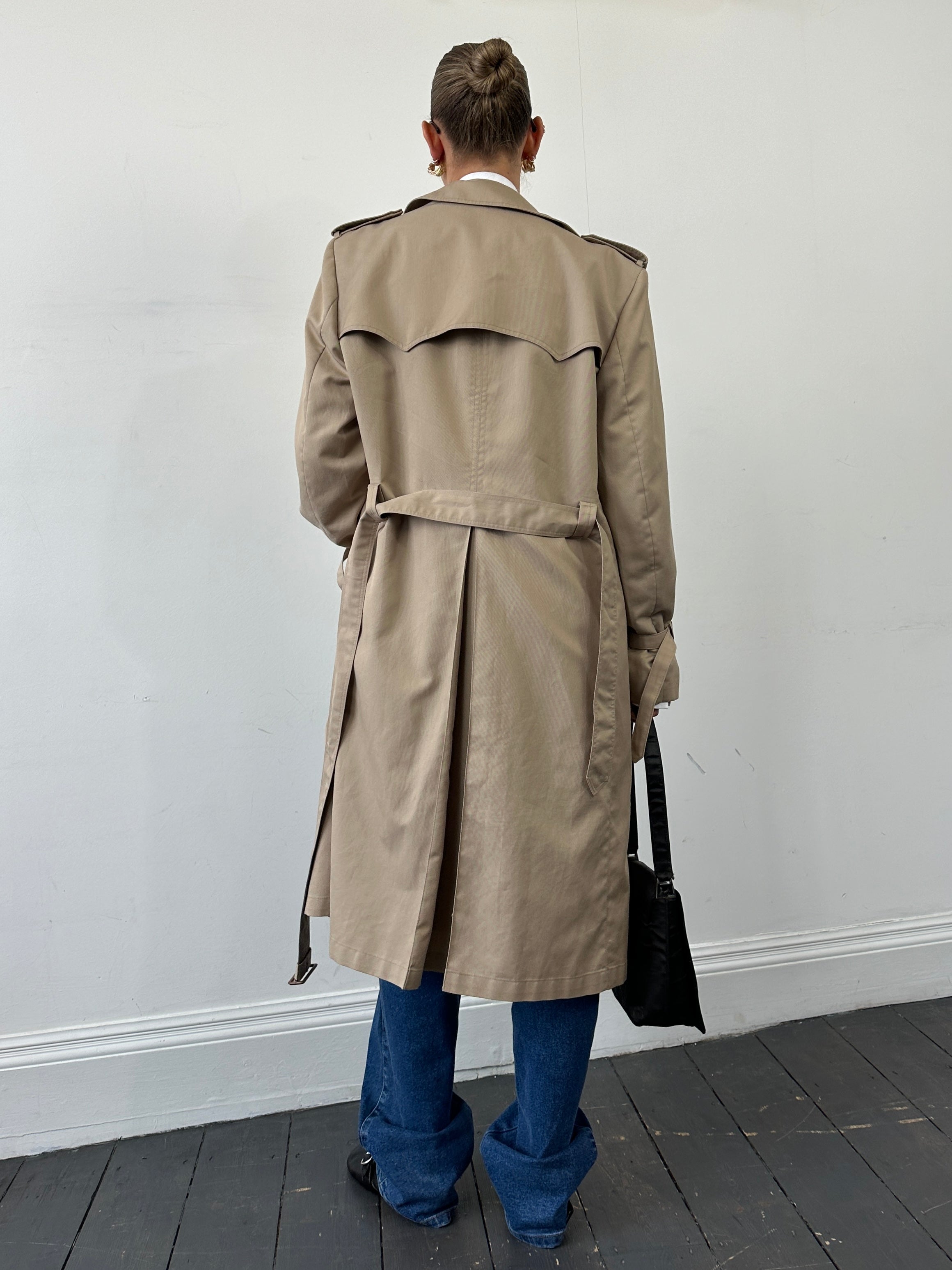 Christian Dior Monsieur double-breasted belted trench coat in size L/XL, showing classic beige fabric, collar, and button details.