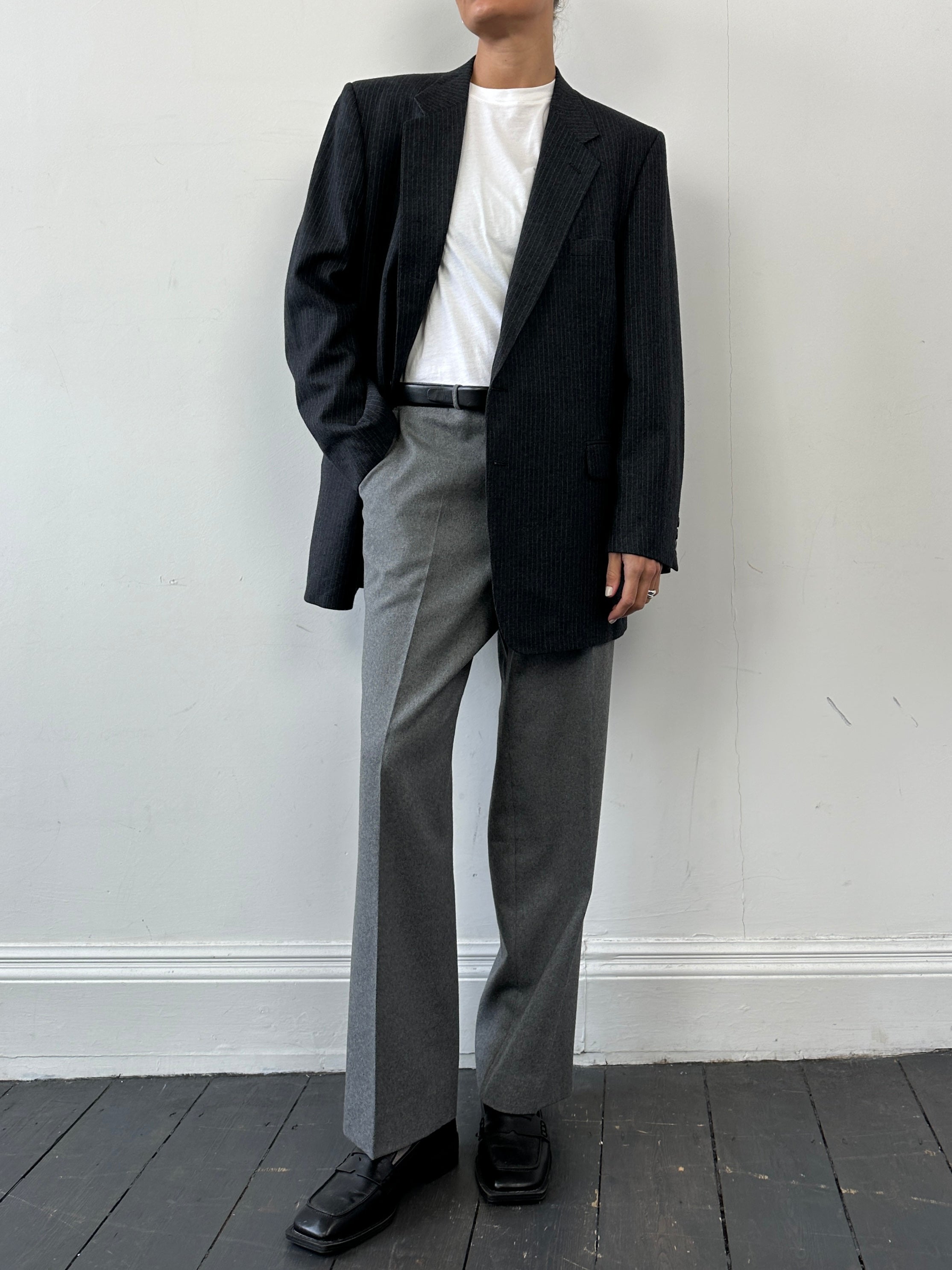 Givenchy pinstripe pure wool single-breasted blazer in size L/XL, featuring classic lapels and tailored fit, displayed on a hanger.