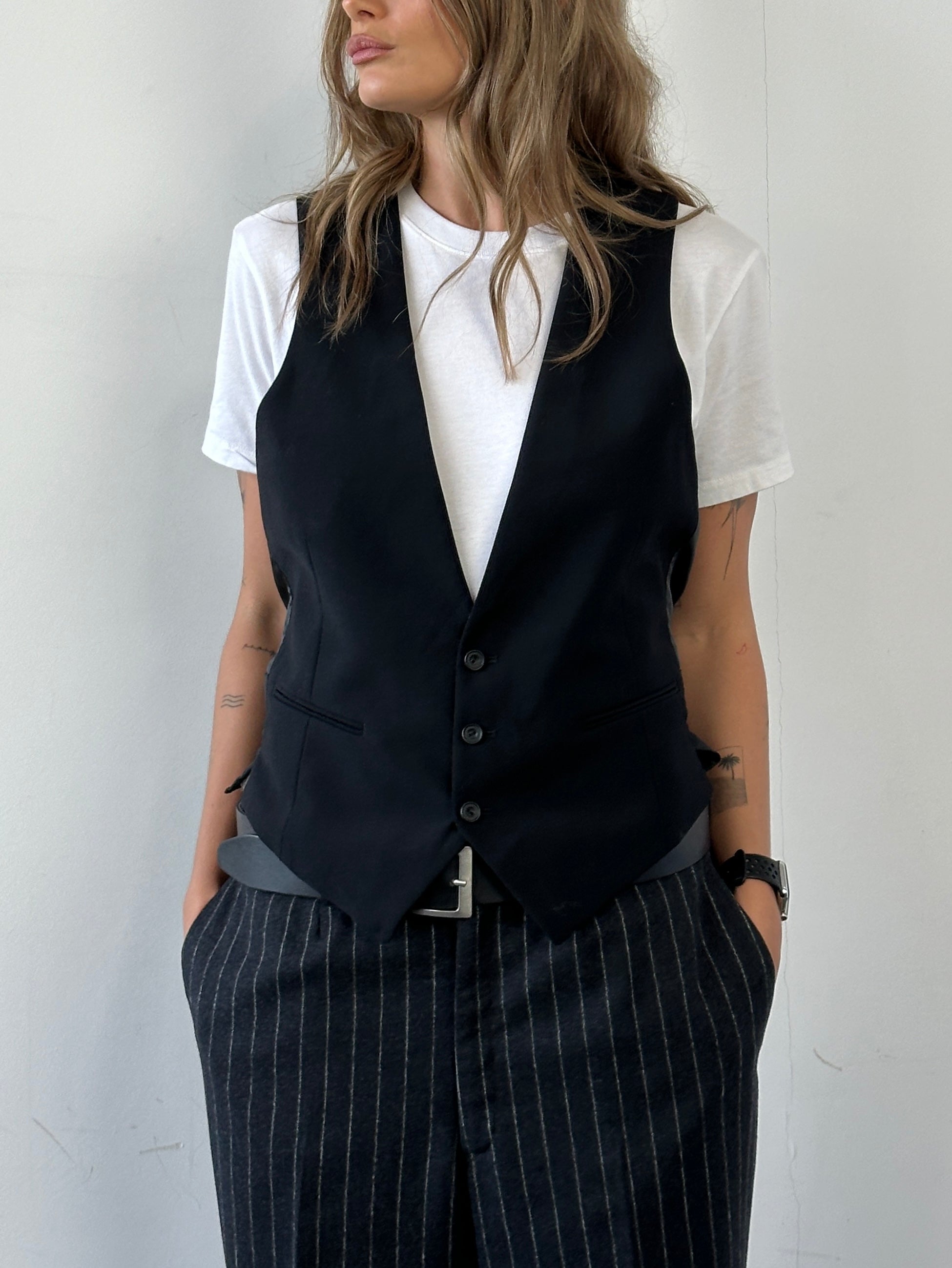 Christian Dior wool tailored waistcoat in size M, featuring a classic design with a structured fit and elegant stitching.