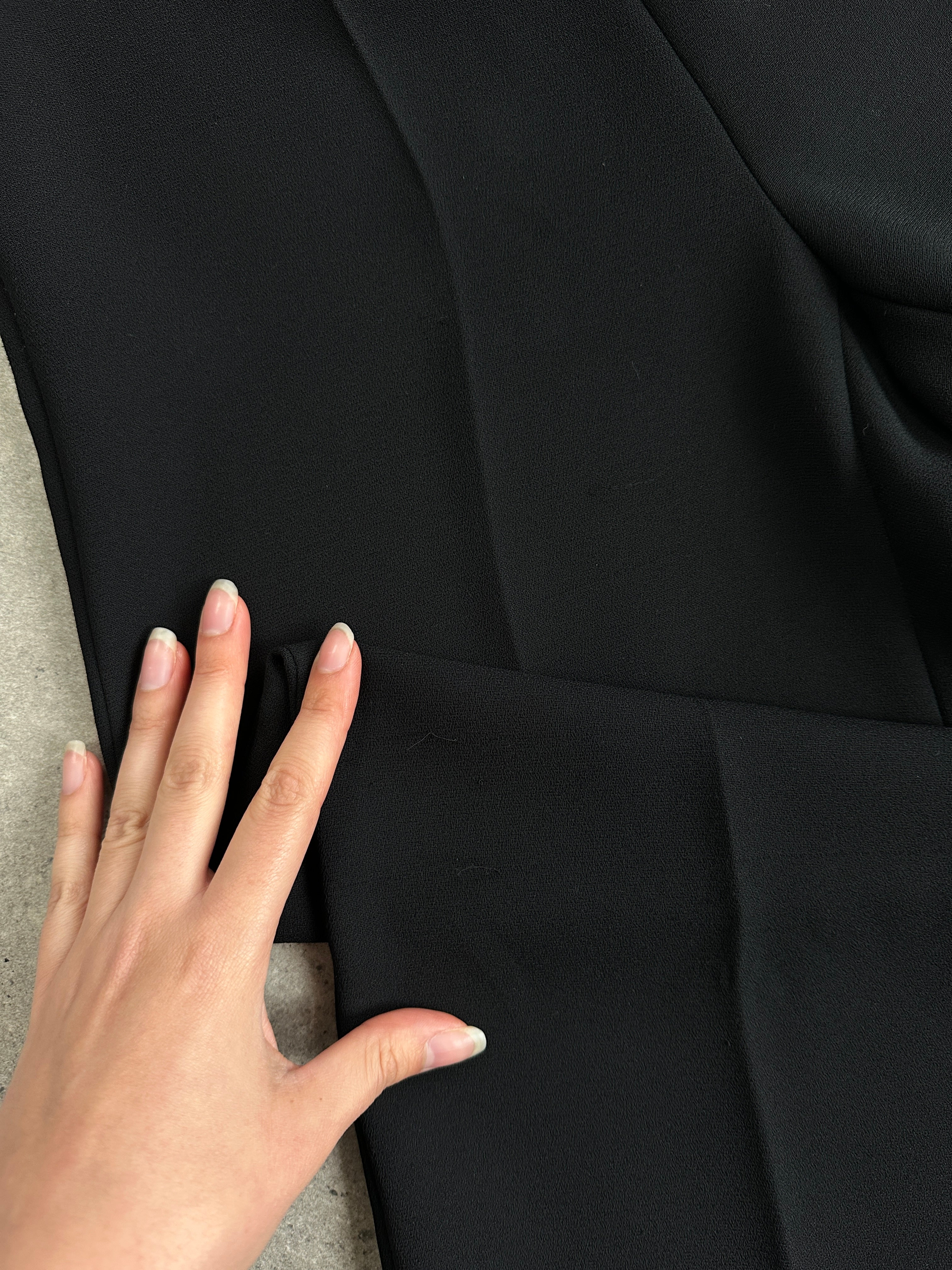 Marella minimal straight leg mid waist trousers in black, showing front view with clean, tailored fit and fabric texture.