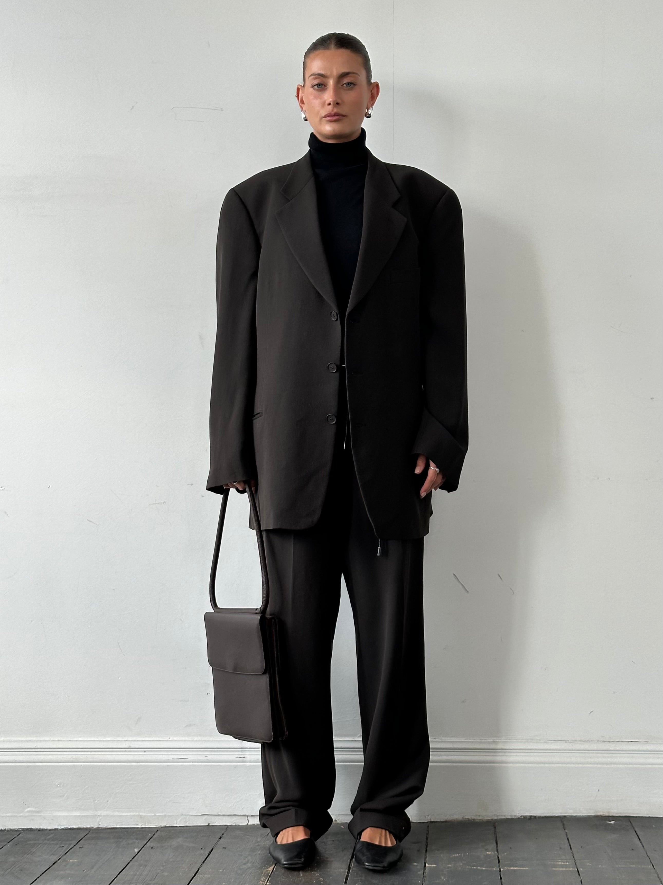 Giorgio Armani Le Collezioni leather shoulder bag with sleek design and metallic hardware, showcasing smooth leather and elegant craftsmanship.