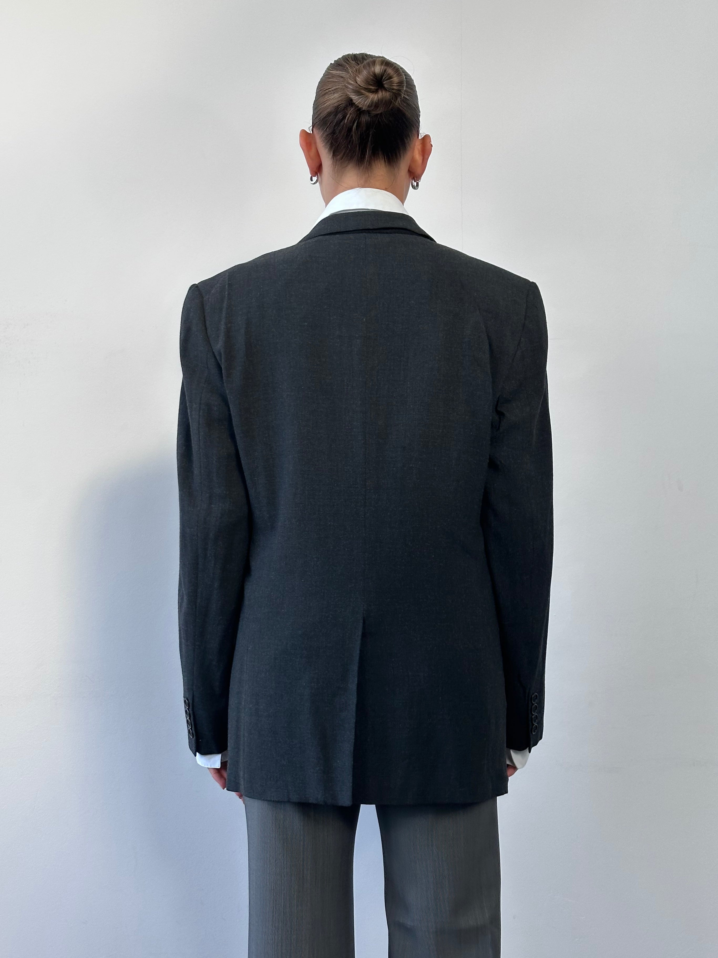 Valentino wool single-breasted blazer in size 36R/M, tailored fit, dark color, featuring classic lapels and button closure.