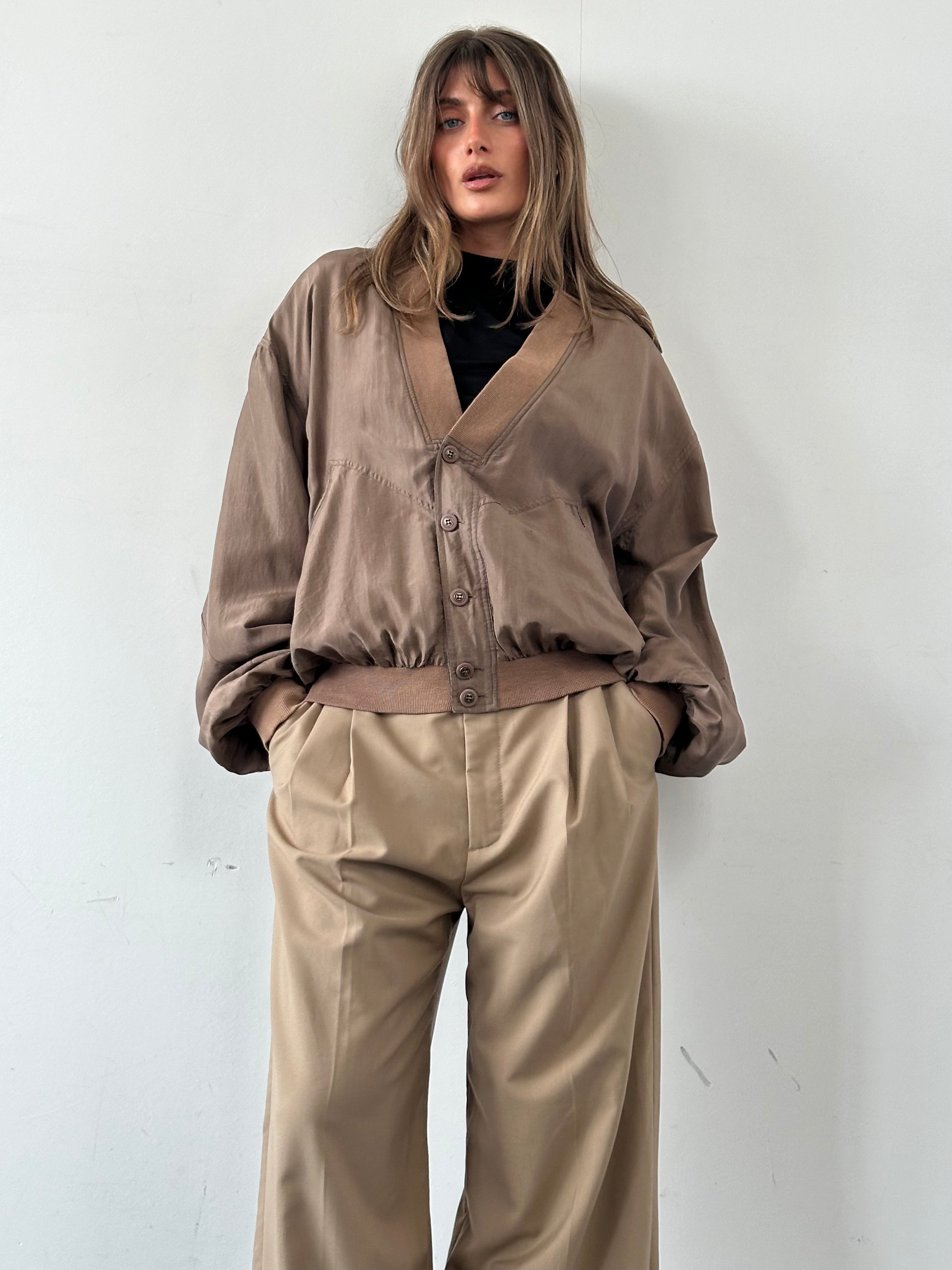 Vintage pure silk bomber jacket in XL, showcasing a stylish, smooth silk fabric with a classic bomber design and ribbed cuffs.