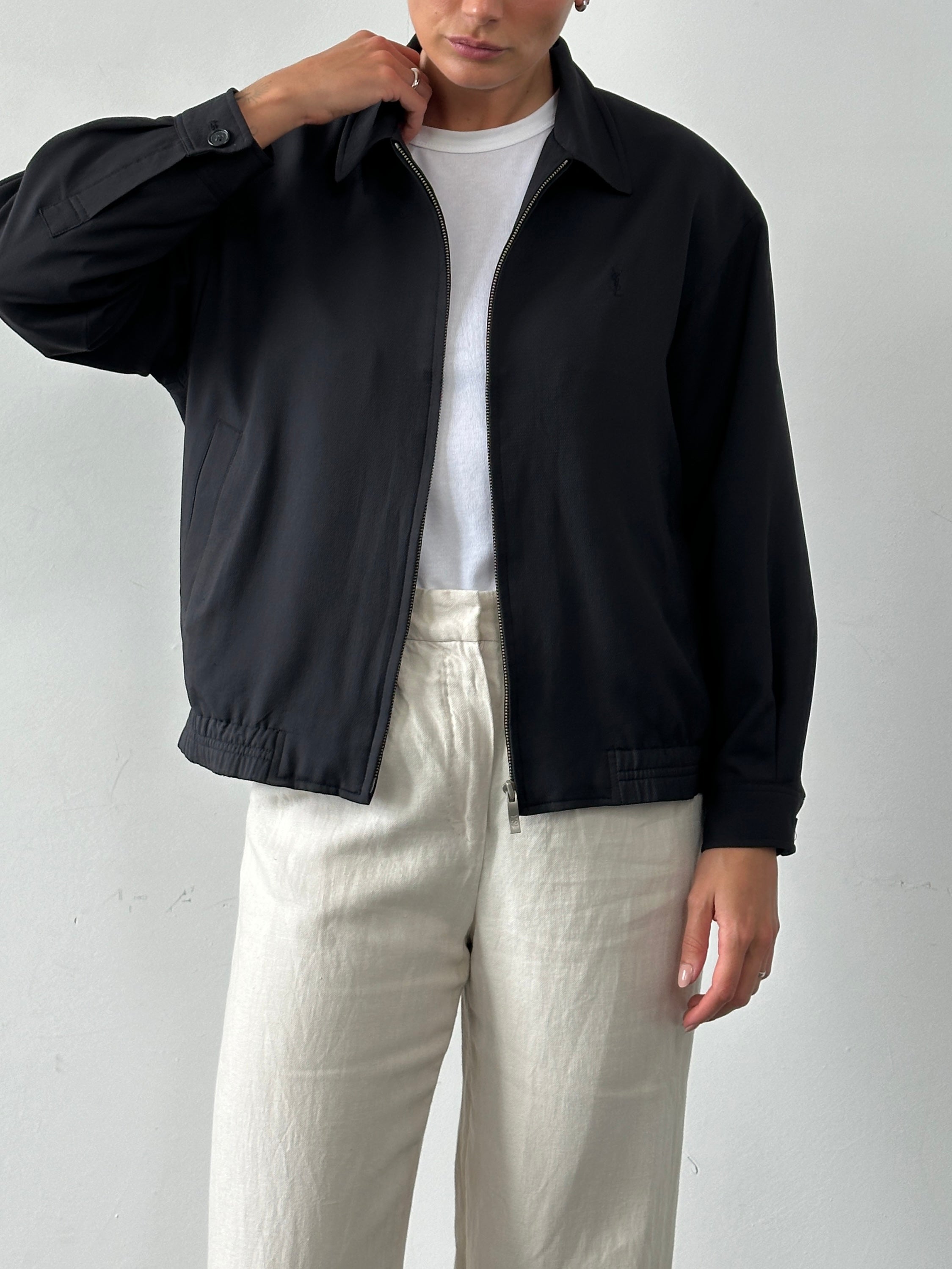 Yves Saint Laurent Pour Homme logo bomber jacket in size M, black with signature branding, front view showing design details.