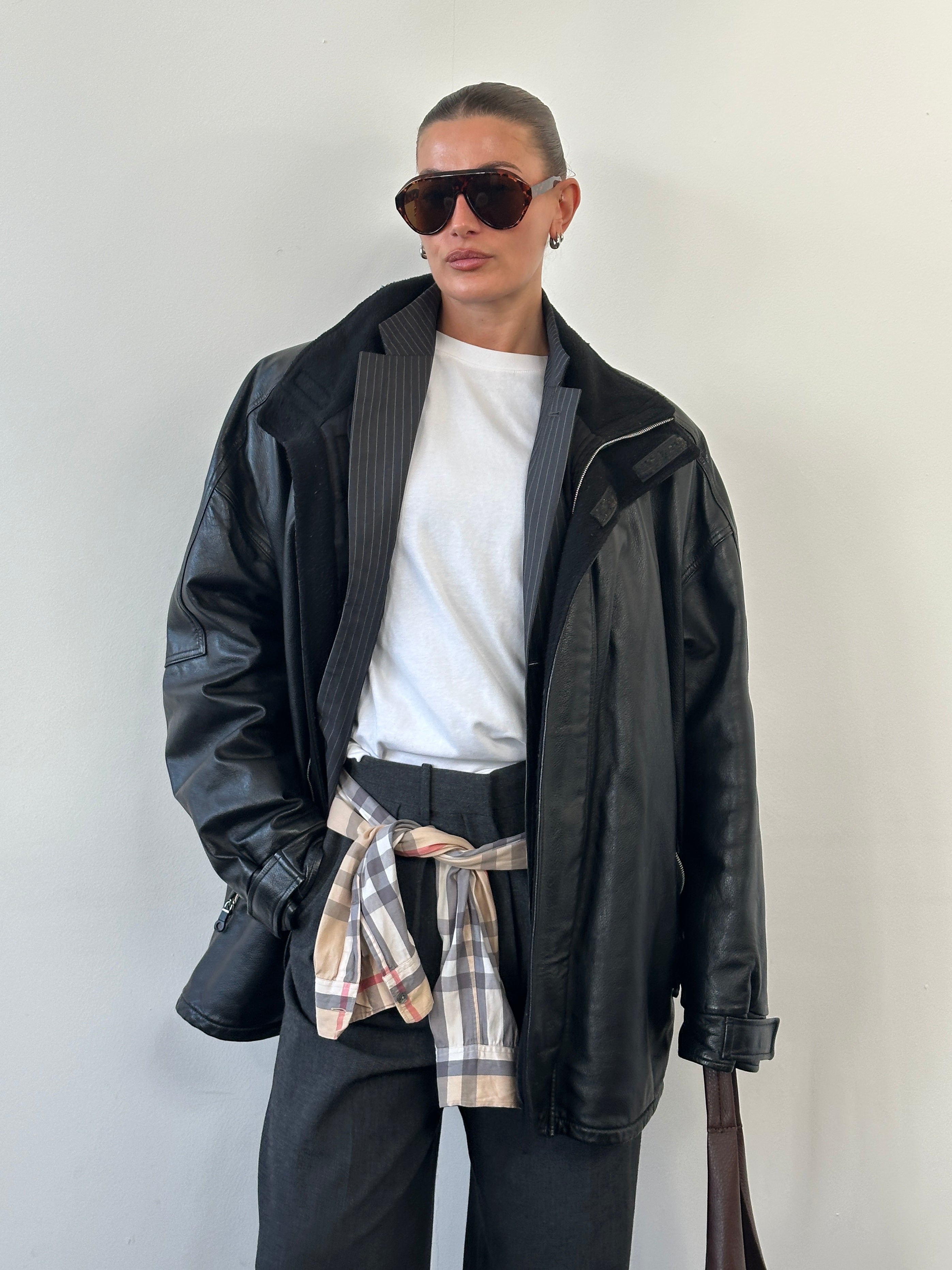 Armani Jeans 2000s black leather jacket with high neck and double zip, size XXL, featuring a stylish modern design.