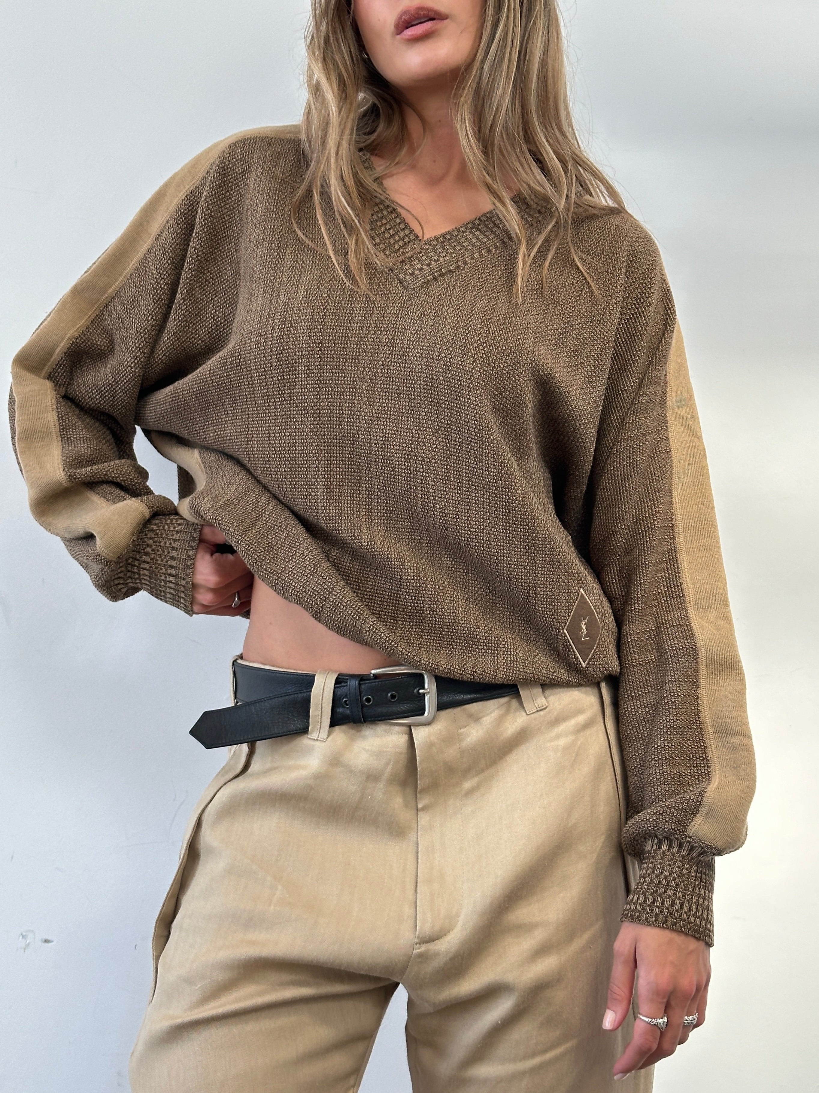 Yves Saint Laurent Tricots 80s pure wool V-neck jumper in black, showing the classic fit and soft knit fabric.