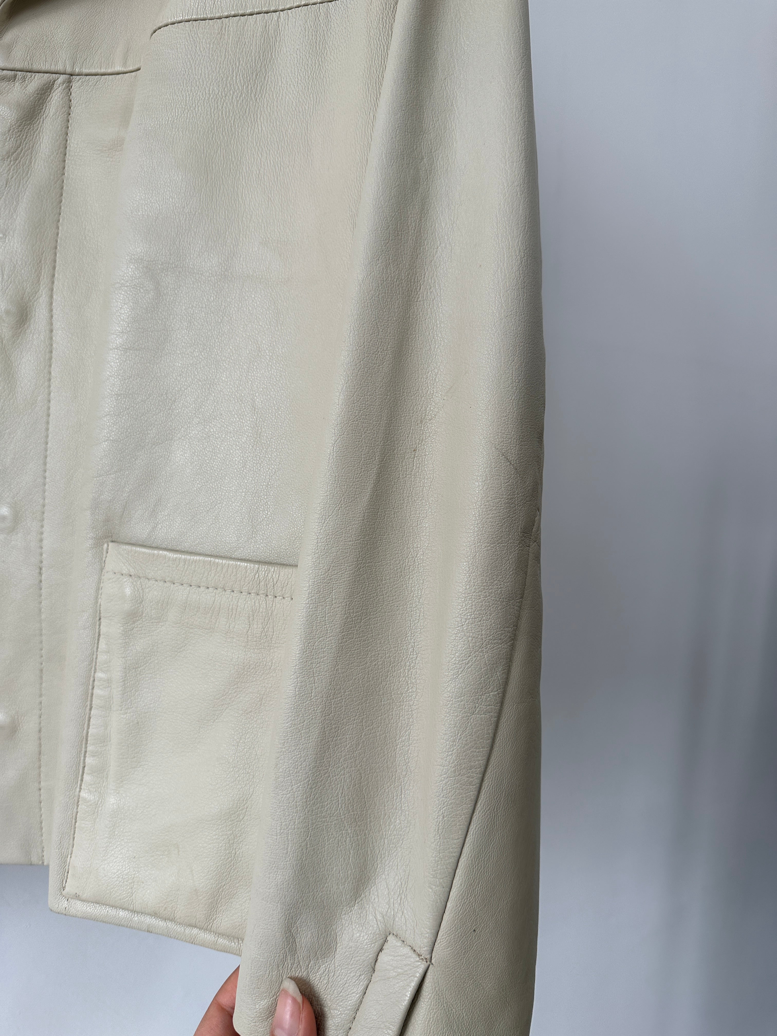 Vintage Italian smooth leather jacket in size M, stylish and classic with a clean fit, showcasing high-quality leather craftsmanship.
