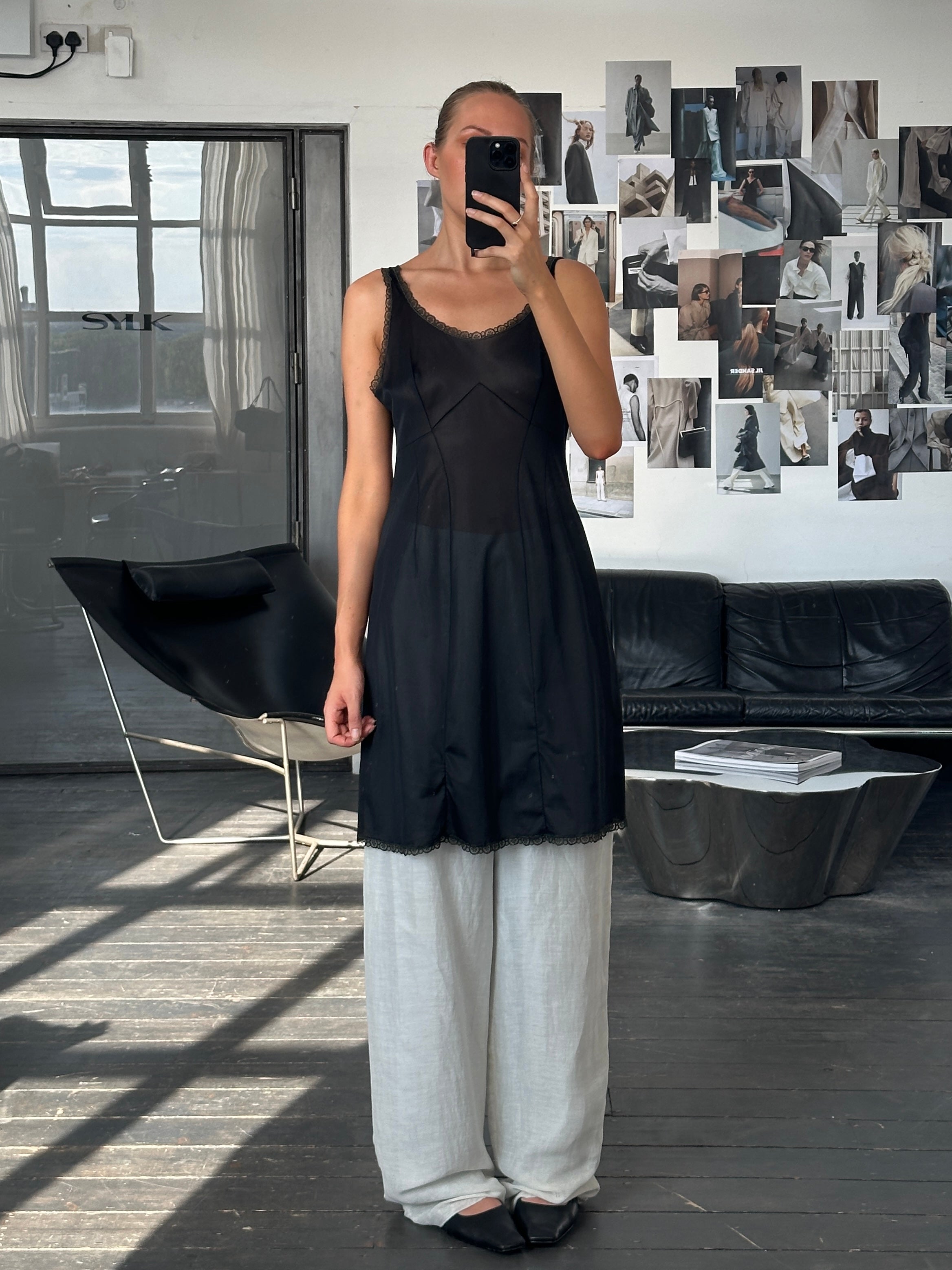 Vintage 1990s lace mini slip dress in size M, featuring delicate lace fabric and a classic vintage style.