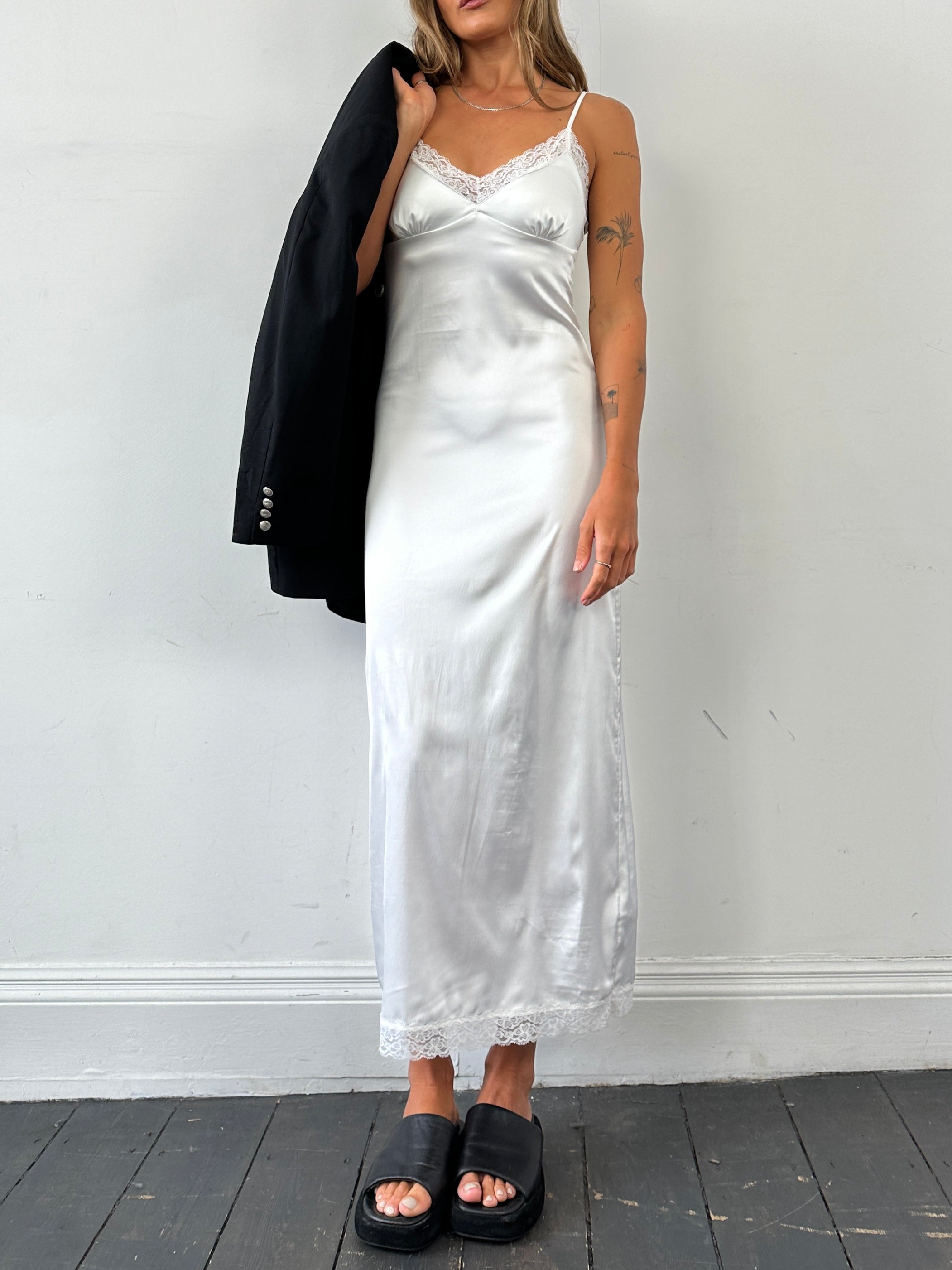 Vintage satin lace trim floor-length slip dress in size small, featuring elegant lace details and a vintage-inspired design.
