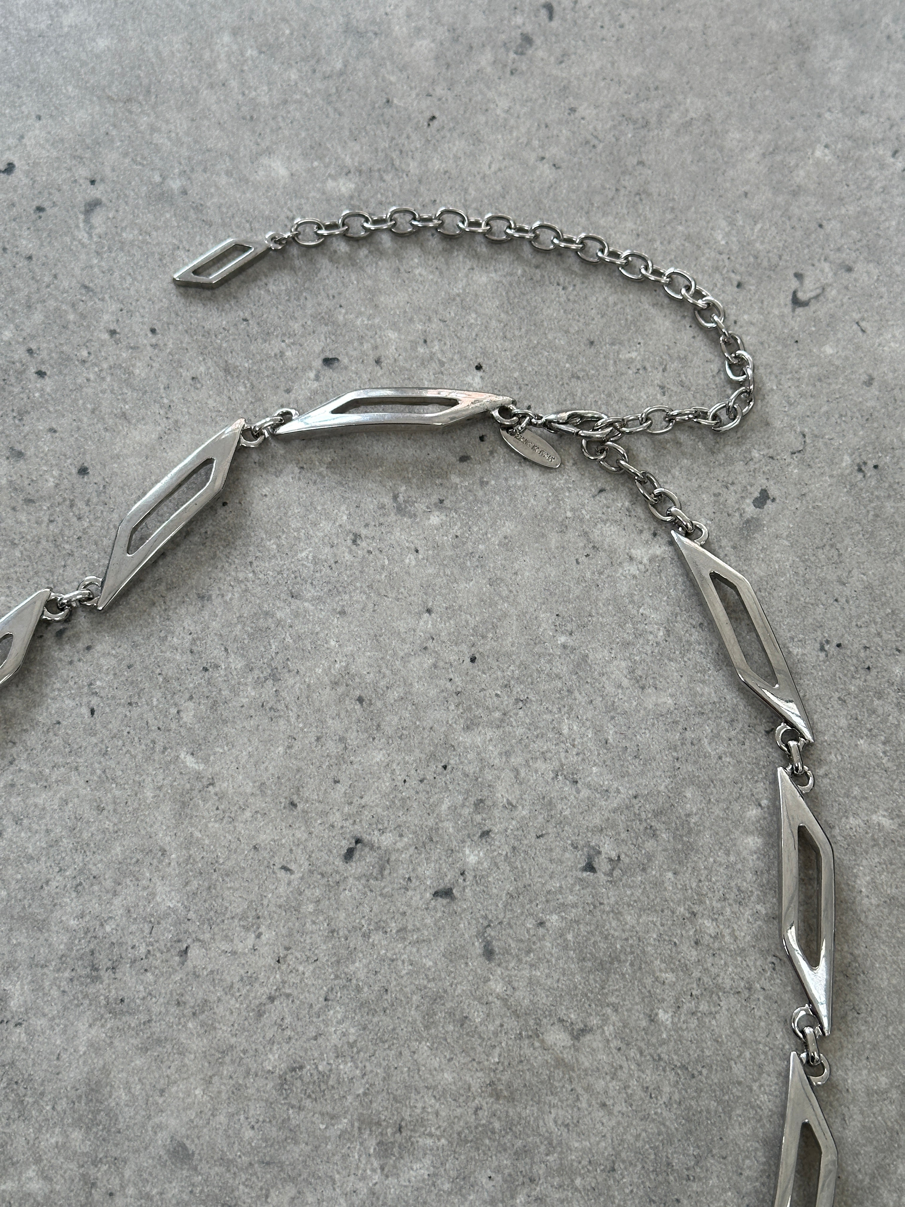 Vintage Italian metal chain belt with adjustable W30-34, featuring vintage-style hardware and intricate chain links.