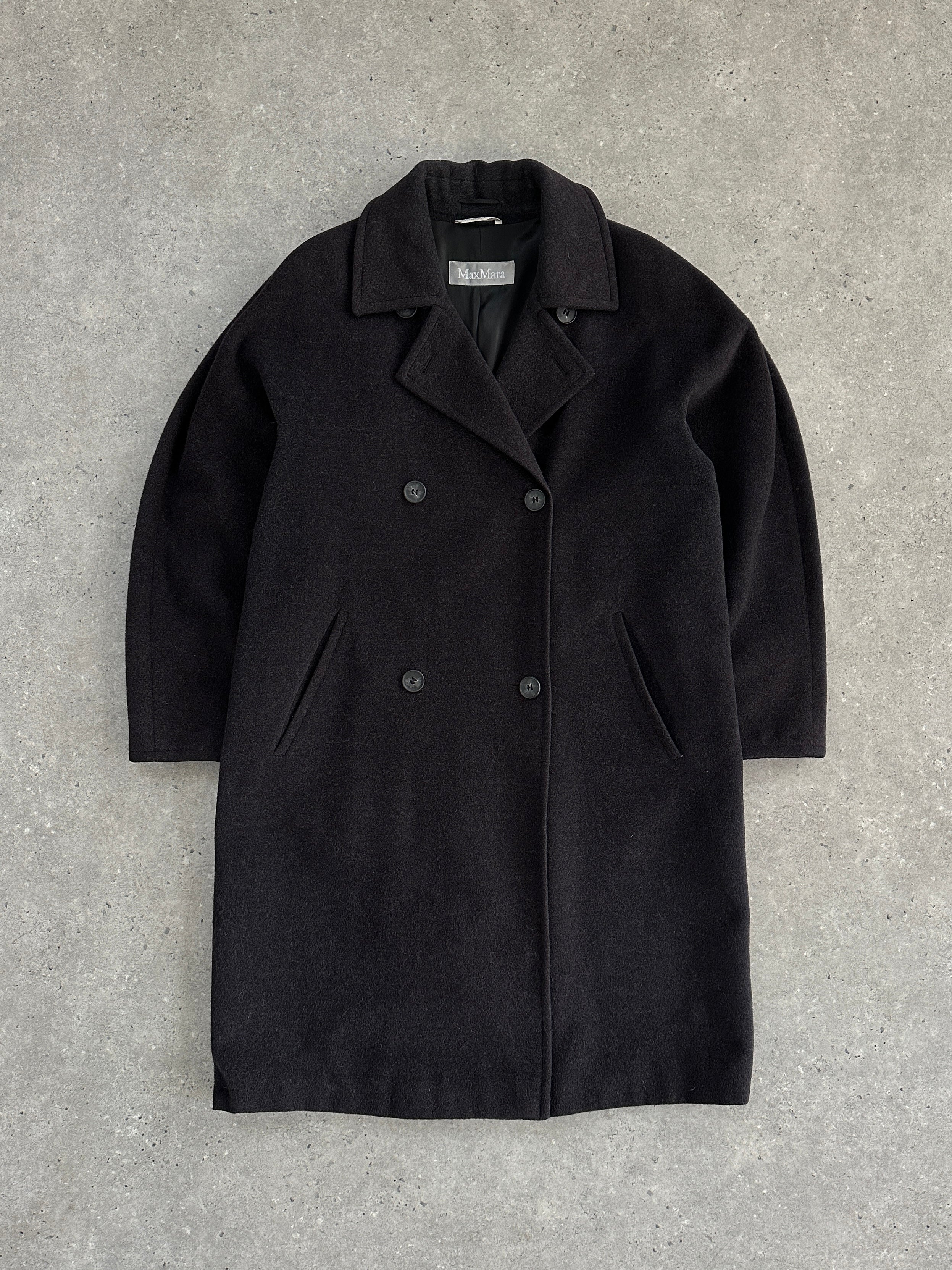 Max Mara pure wool double-breasted coat in size M, tailored fit with classic lapels and button closures, shown on a hanger.