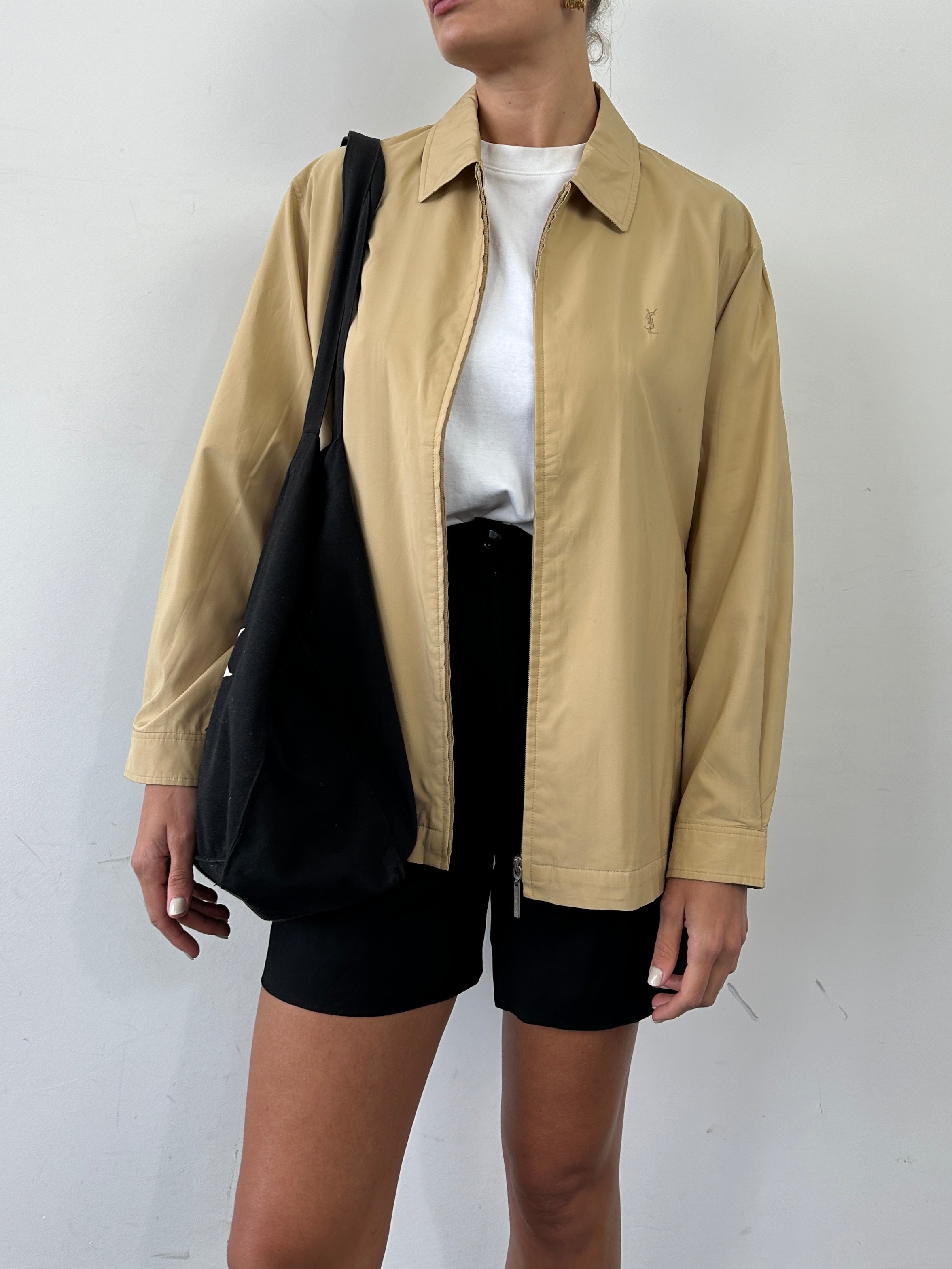Yves Saint Laurent Pour Homme showerproof logo bomber jacket in size L, featuring a sleek design with YSL branding and modern style.