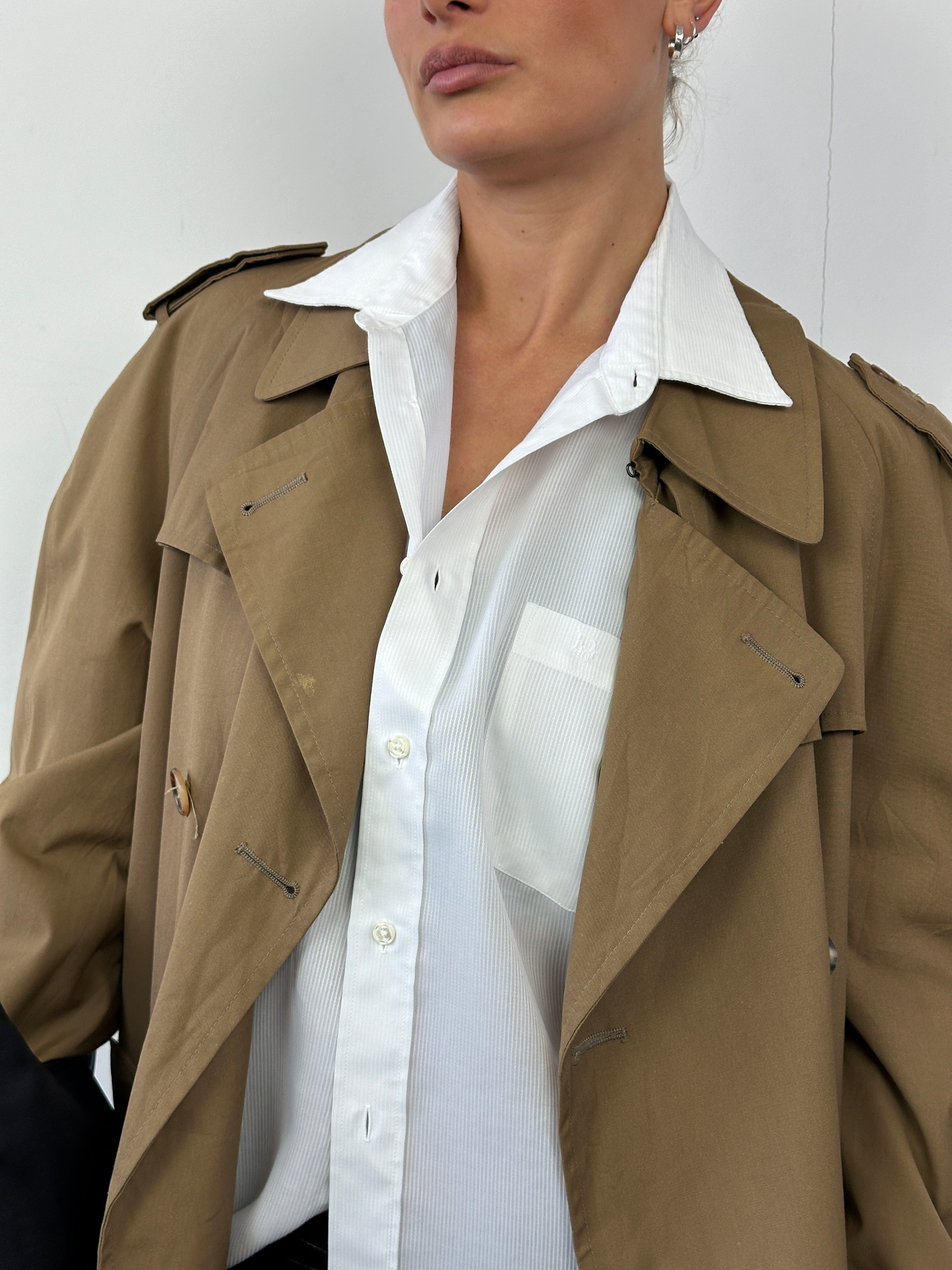 Christian Dior cotton double-breasted trench coat in size L, showing classic beige color and tailored fit with button details.