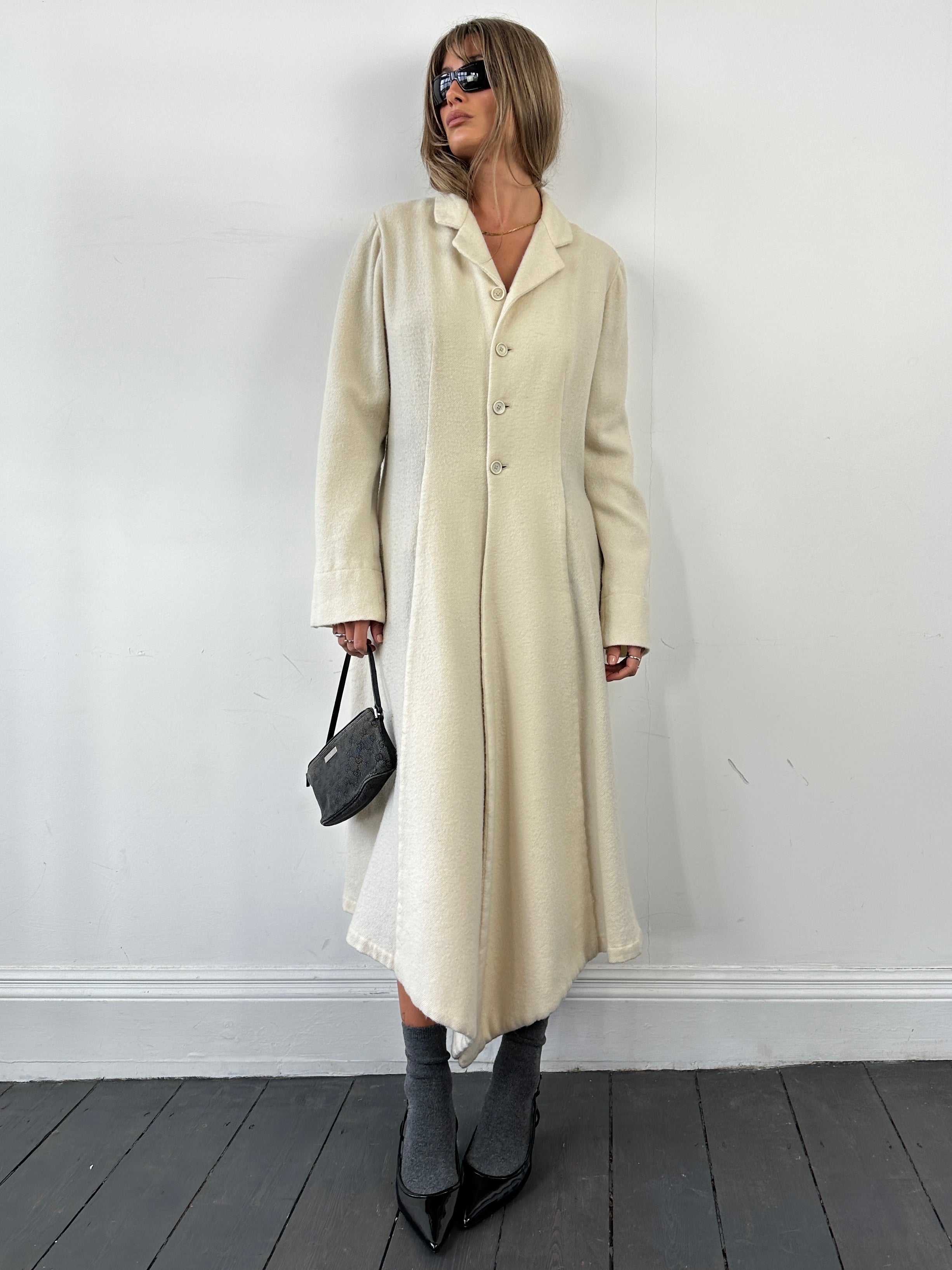 Comme des Garçons 90s unlined pure wool waterfall coat, front view showing draped collar and elegant silhouette.