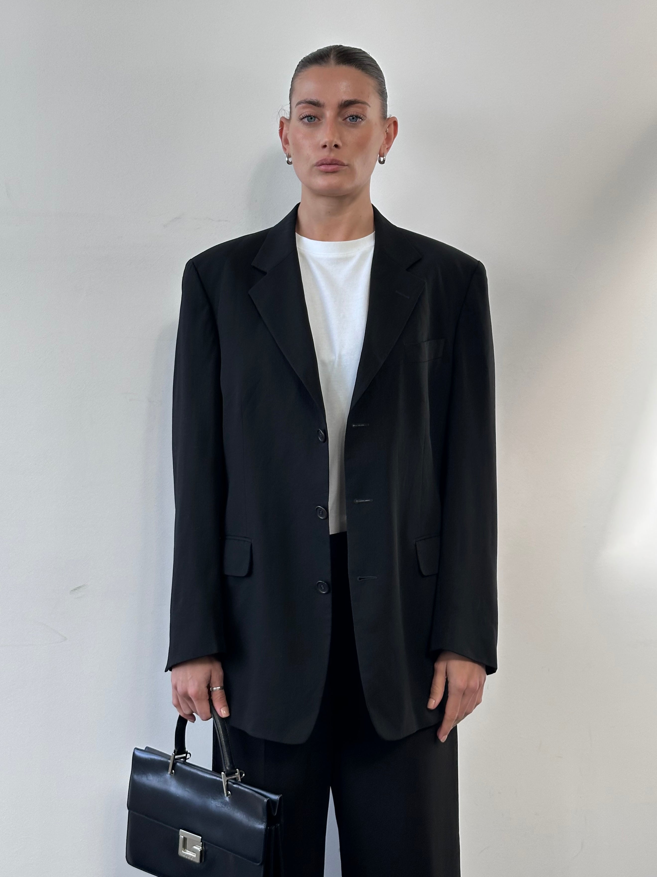 Yves Saint Laurent Pour Homme 1990s pure wool single-breasted blazer in size 40R/L, dark tailored jacket with lapels and buttons.