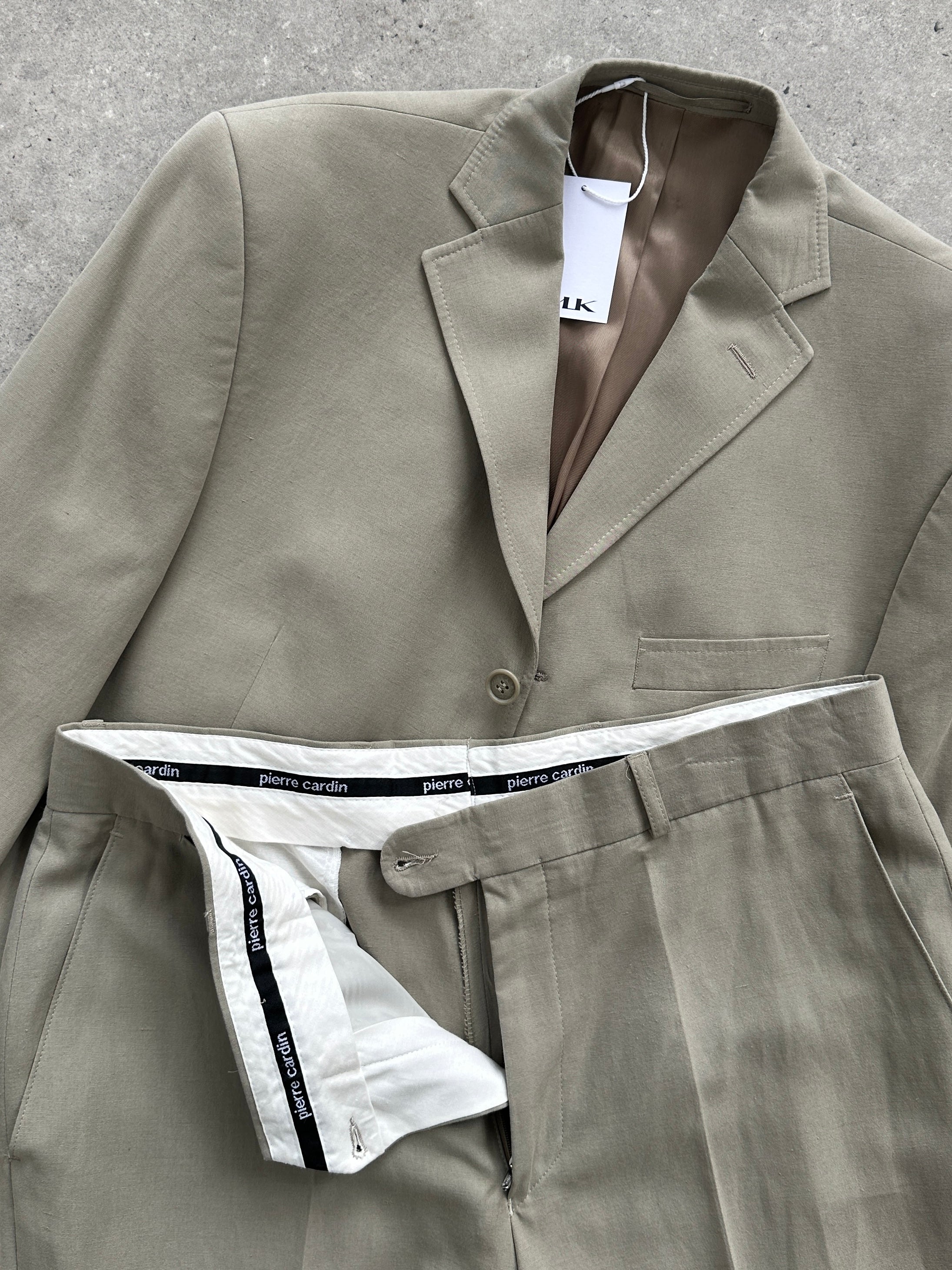 Pierre Cardin lyocell single-breasted jumpsuit in size 42R/W34, featuring a tailored fit and elegant design.