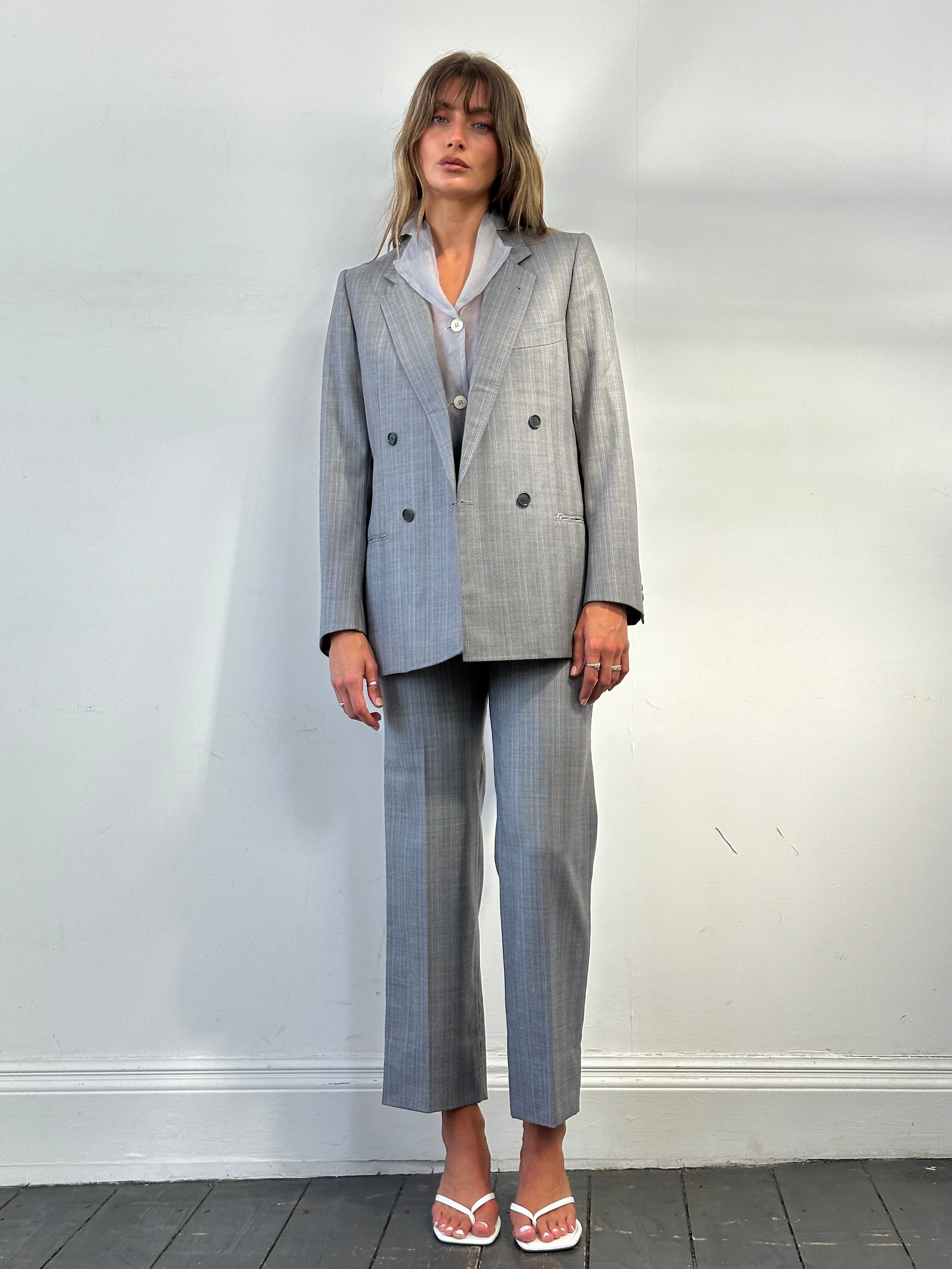 Vintage Italian vintage pure wool stripe double-breasted suit in size 36R/W28, featuring classic tailored design and bold stripe pattern.