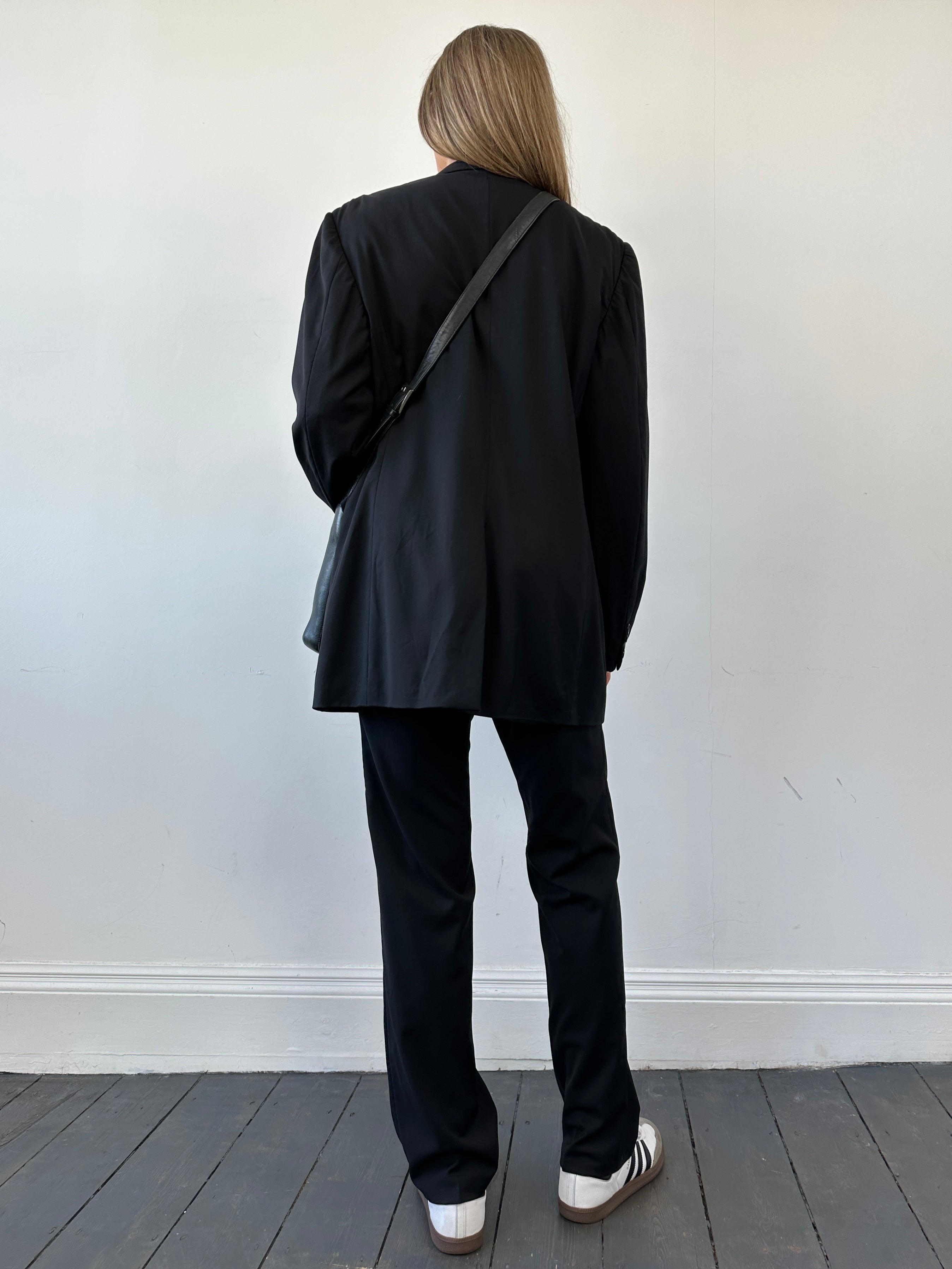 Prada virgin wool mid-rise single-breasted jumpsuit in size 40L/W28, tailored fit with lapel collar and front buttons.