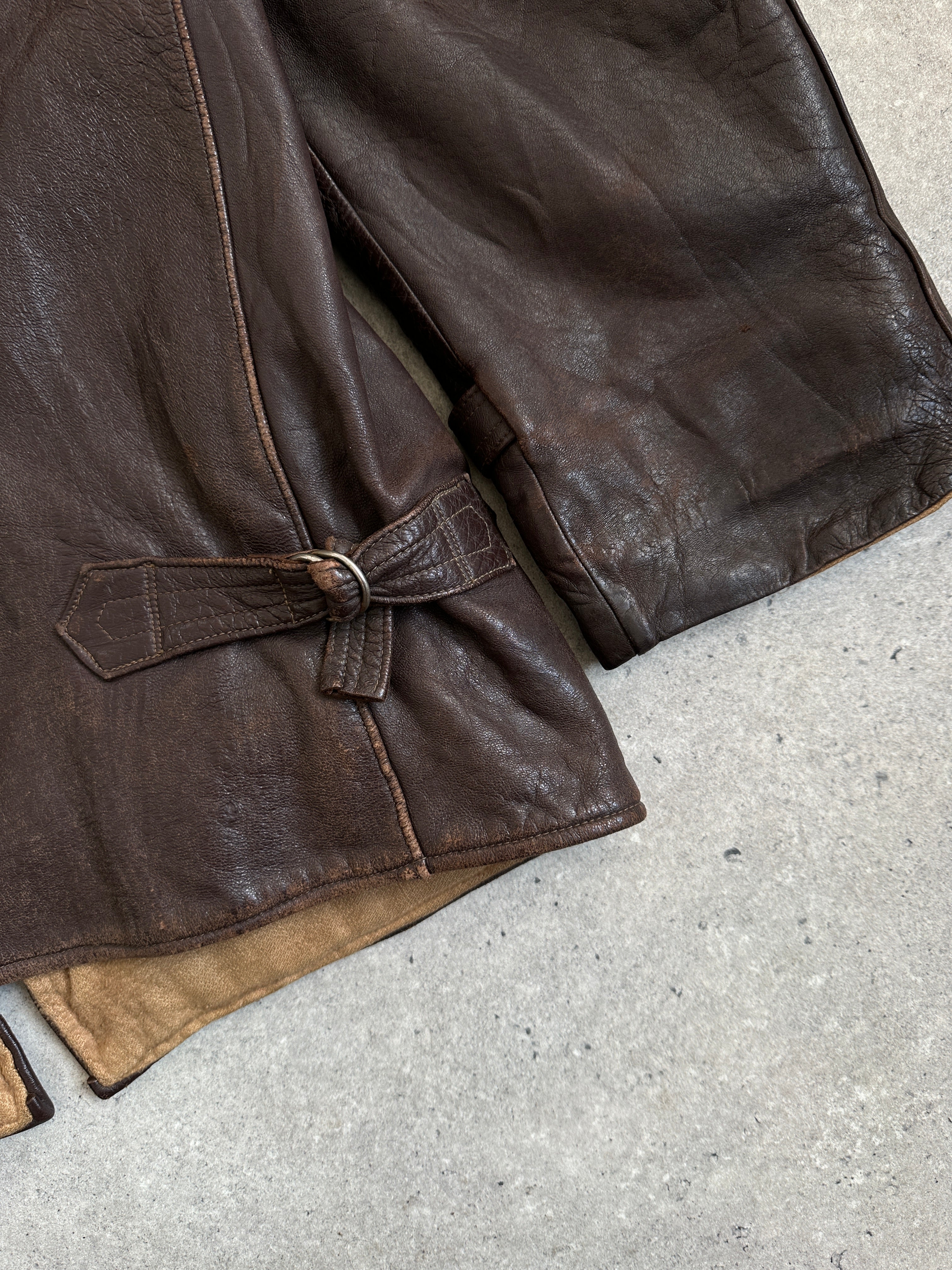 Vintage distressed leather jacket in XL, mid-length style with rugged, vintage-inspired design and classic leather detailing.