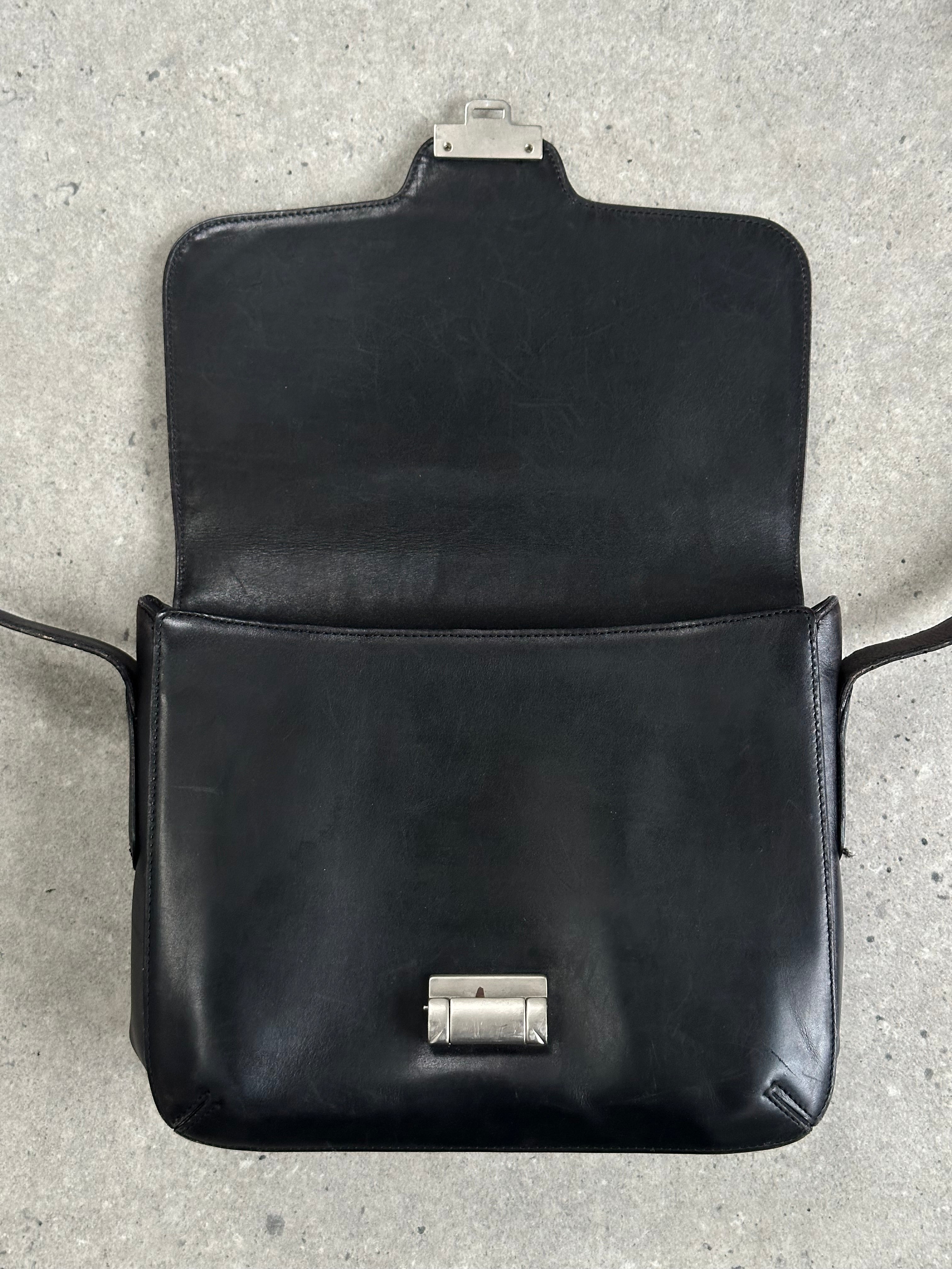 Giorgio Armani Le Collezioni leather crossbody bag in classic design, featuring sleek leather and subtle branding details.