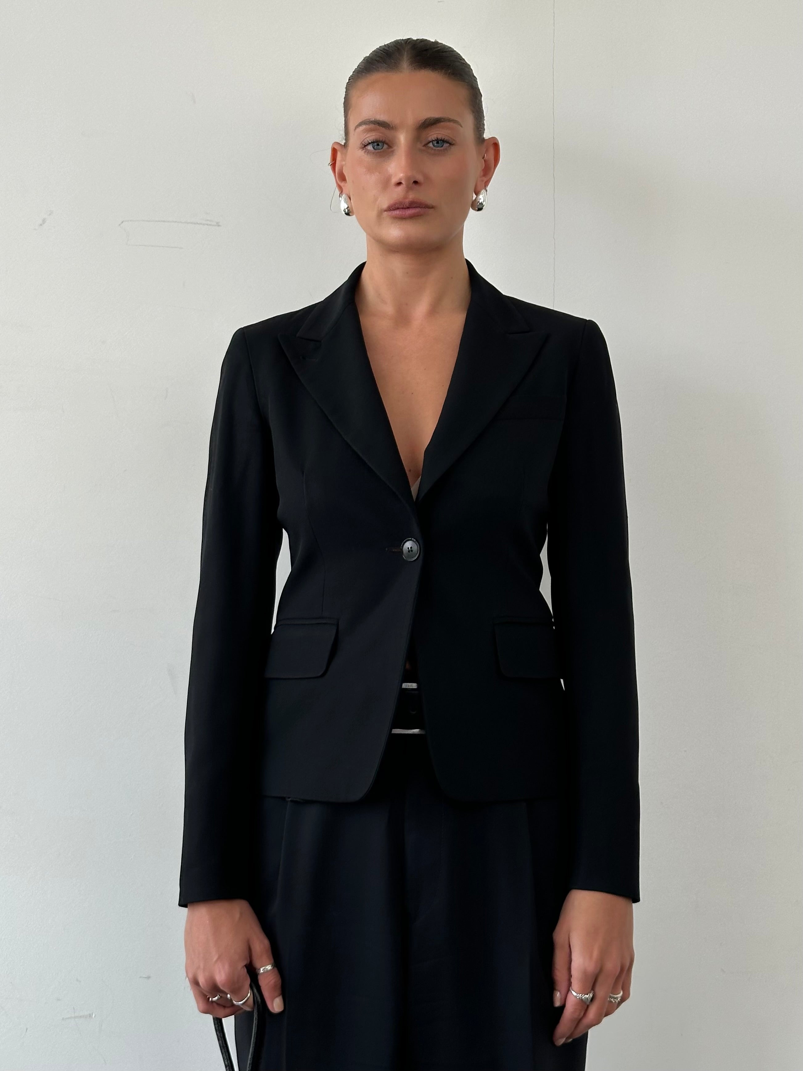 Max Mara pure wool fitted blazer in XS/S, tailored for a sleek, structured look, displayed on a hanger against a neutral background.
