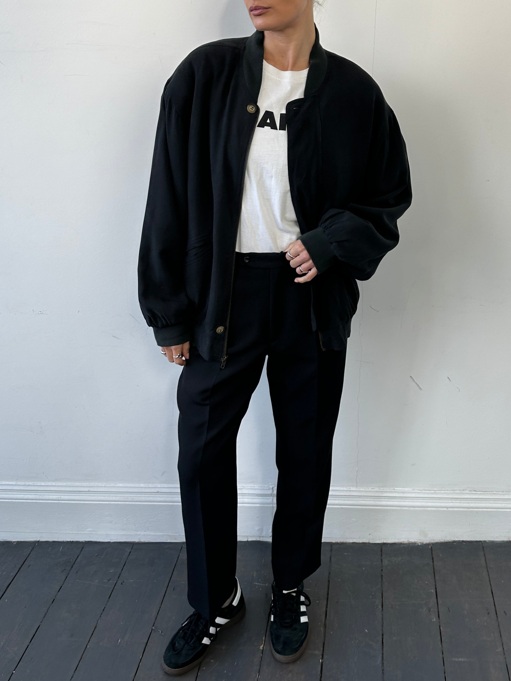 Vintage Italian pure silk bomber jacket in size large, featuring classic design and luxurious fabric with detailed stitching.