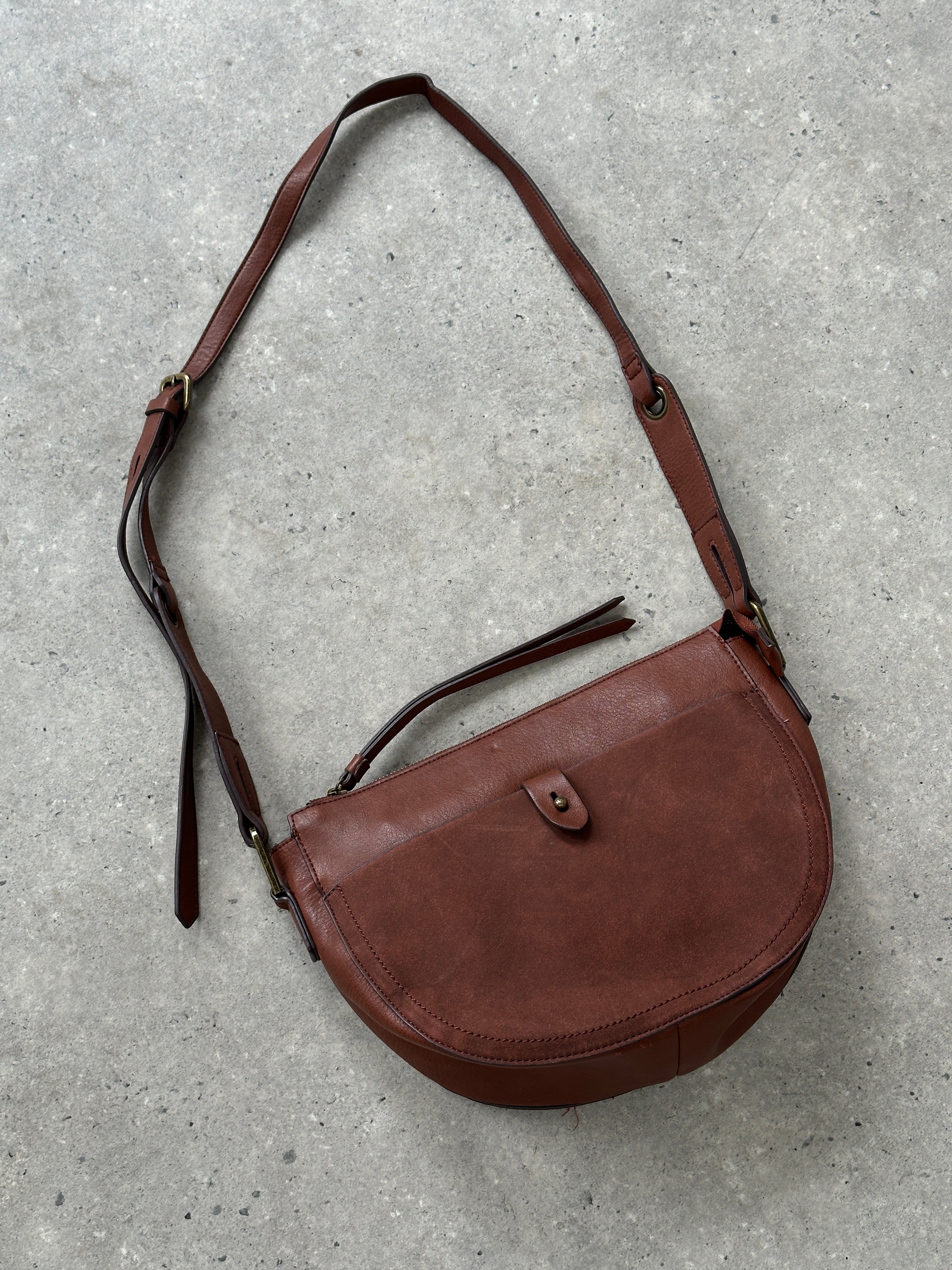 Vintage faux leather crescent crossbody bag with adjustable strap and minimalist design, perfect for casual or chic outfits.