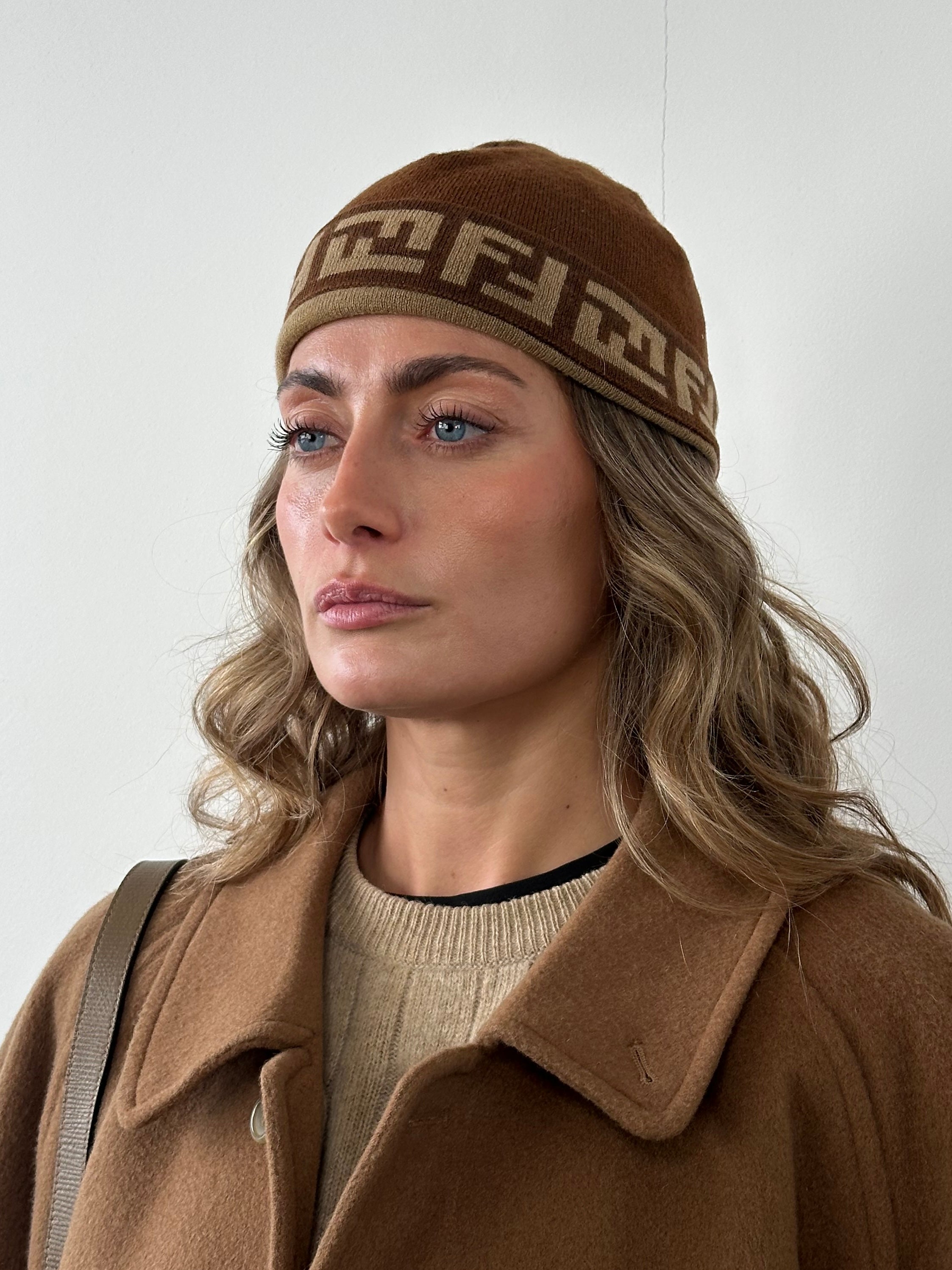 Fendi FF monogram print beanie hat in knit fabric, featuring the iconic logo pattern and a snug fit for winter warmth.
