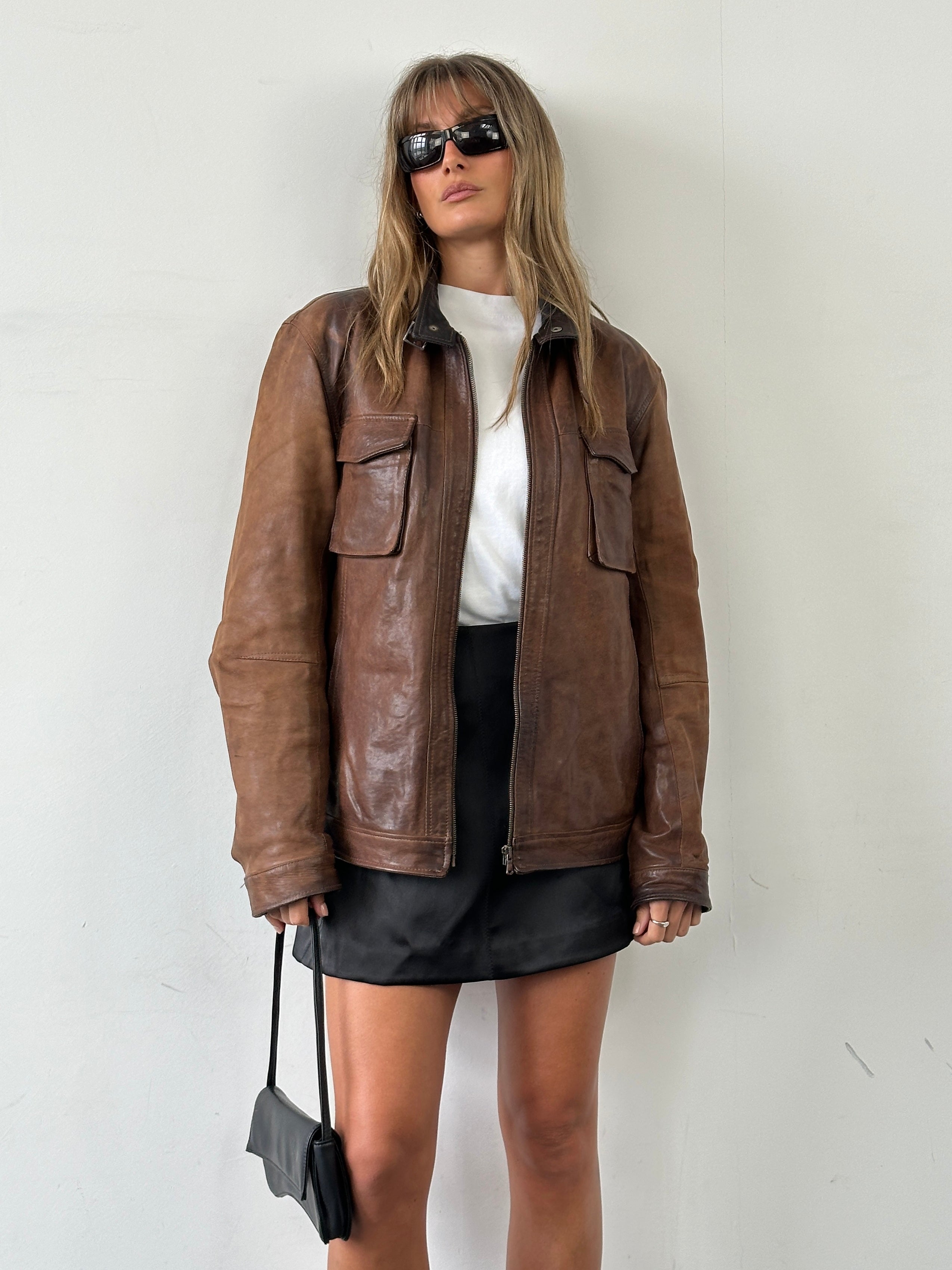 Vintage Italian vintage aged leather jacket, size L, showcasing classic design and rich textured leather.
