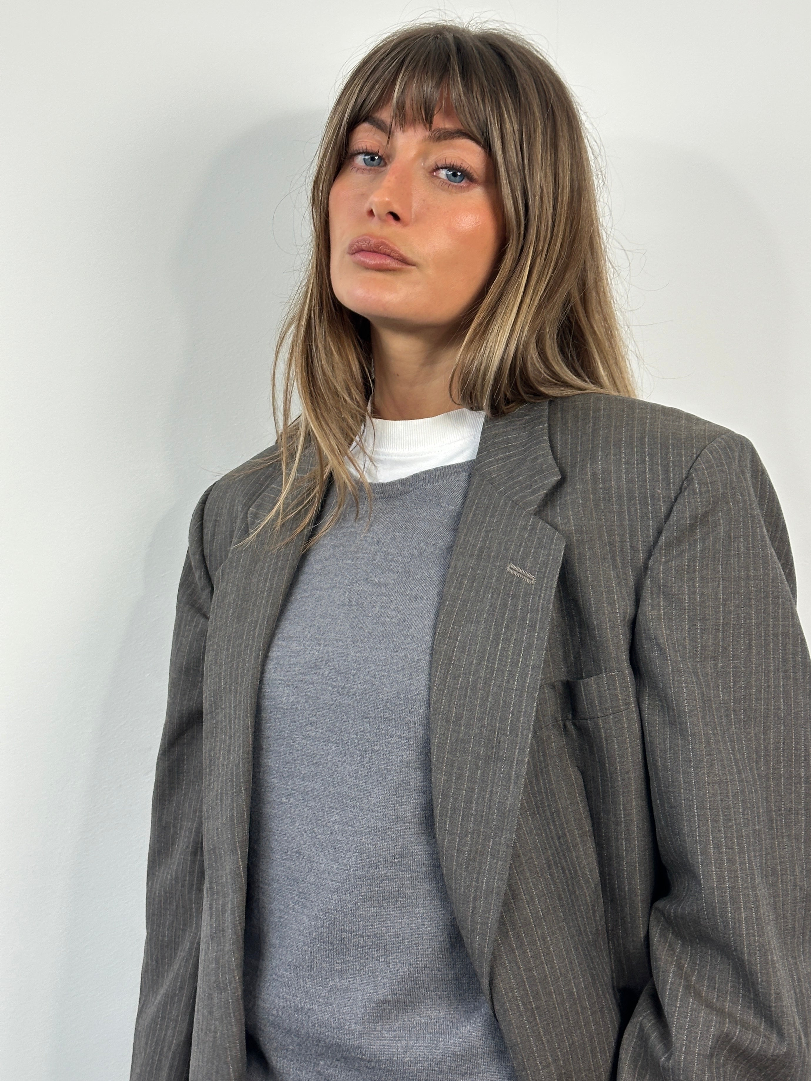 Christian Dior Monsieur 1990s striped single-breasted blazer in size 40R/L, tailored fit with classic lapel and button closure.