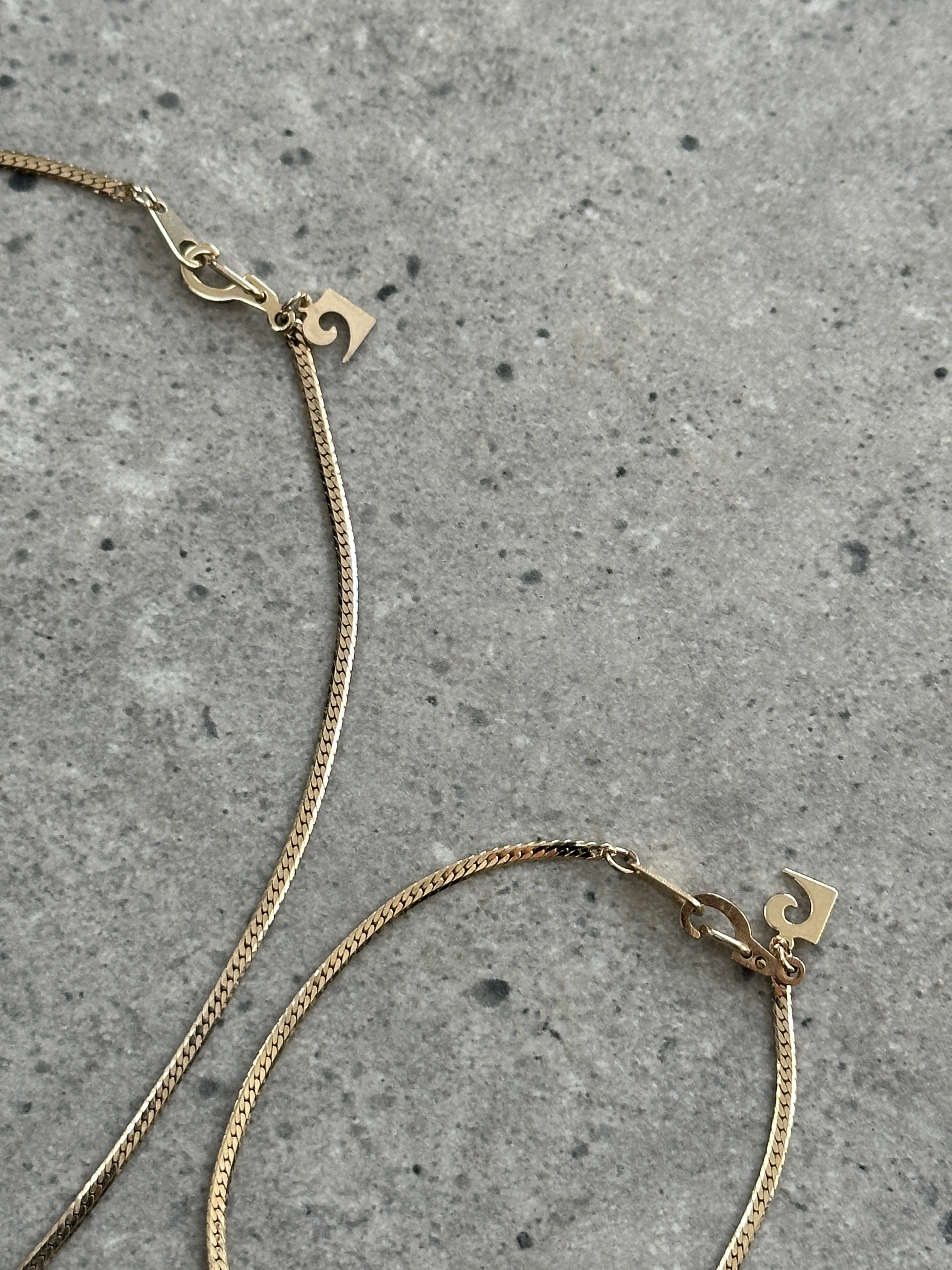 Pierre Cardin gold plated necklace and bracelet chain set with elegant links and clasp, showcasing luxurious jewelry design.