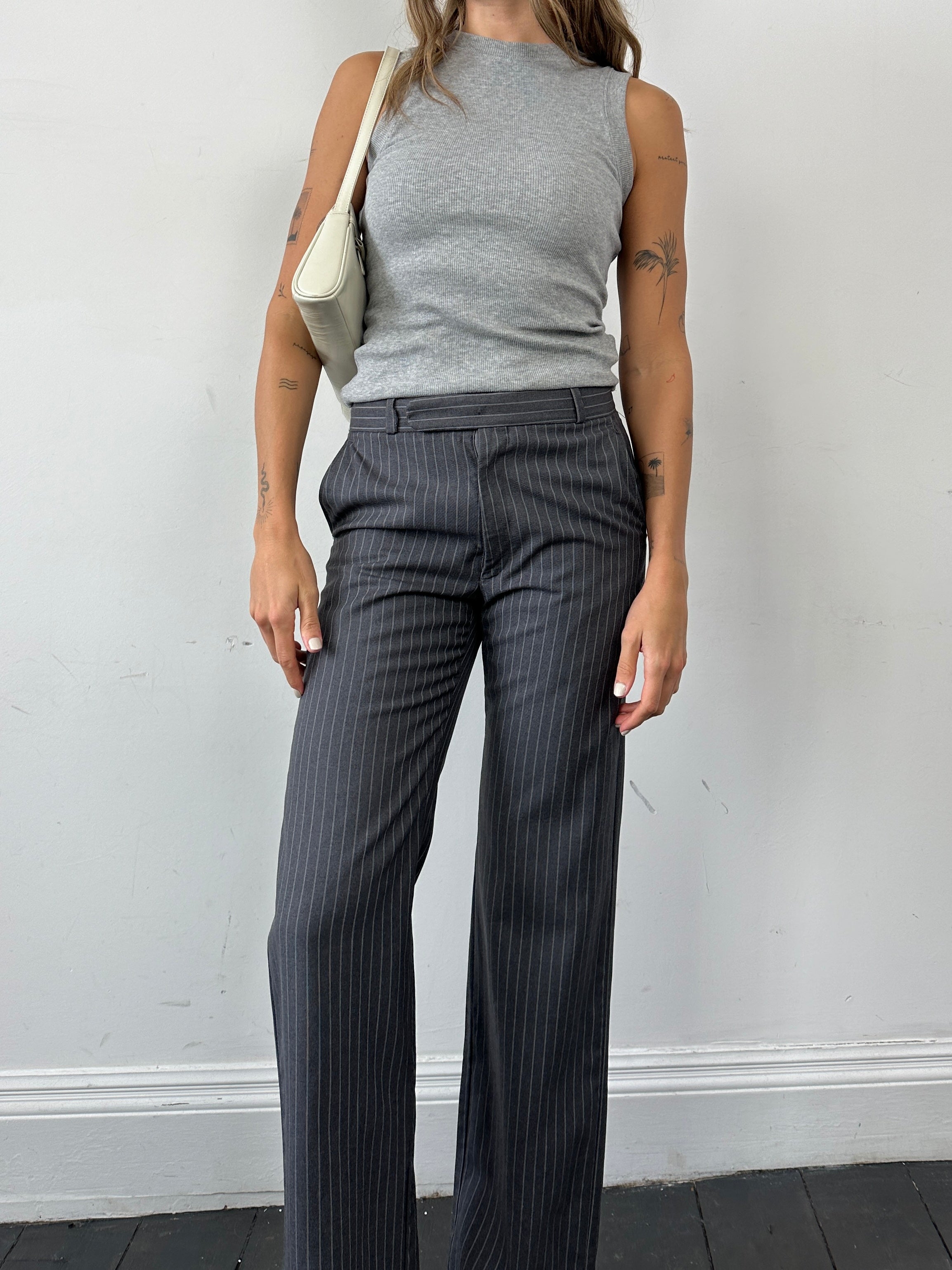Christian Dior pinstripe wool mid-waist straight-leg trousers, size W30, featuring classic tailored design and pinstripe pattern.