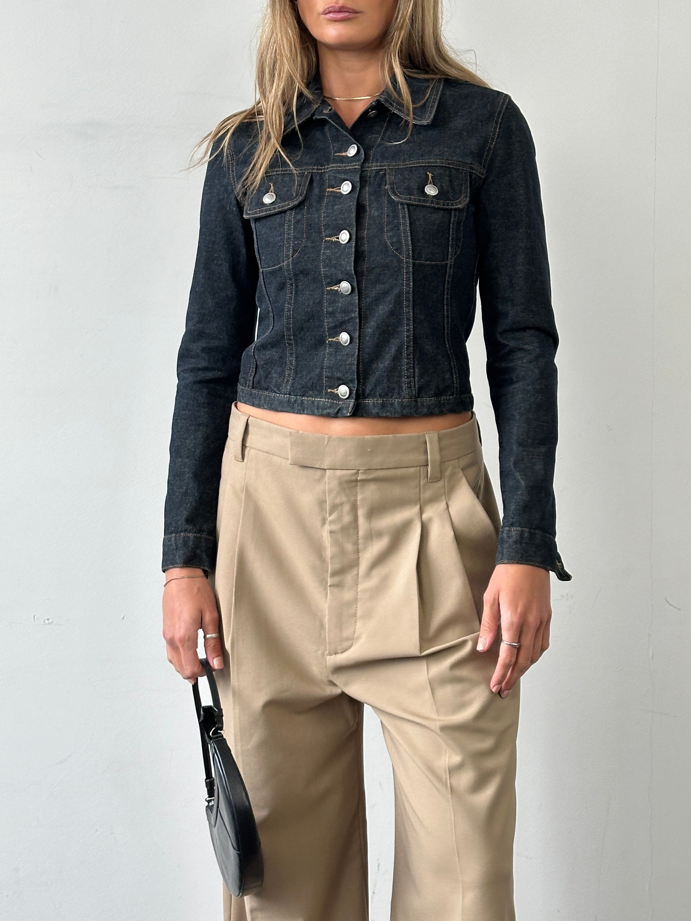 Vintage Italian vintage fitted raw denim jacket in XS/S, showing classic distressed details and tailored fit.