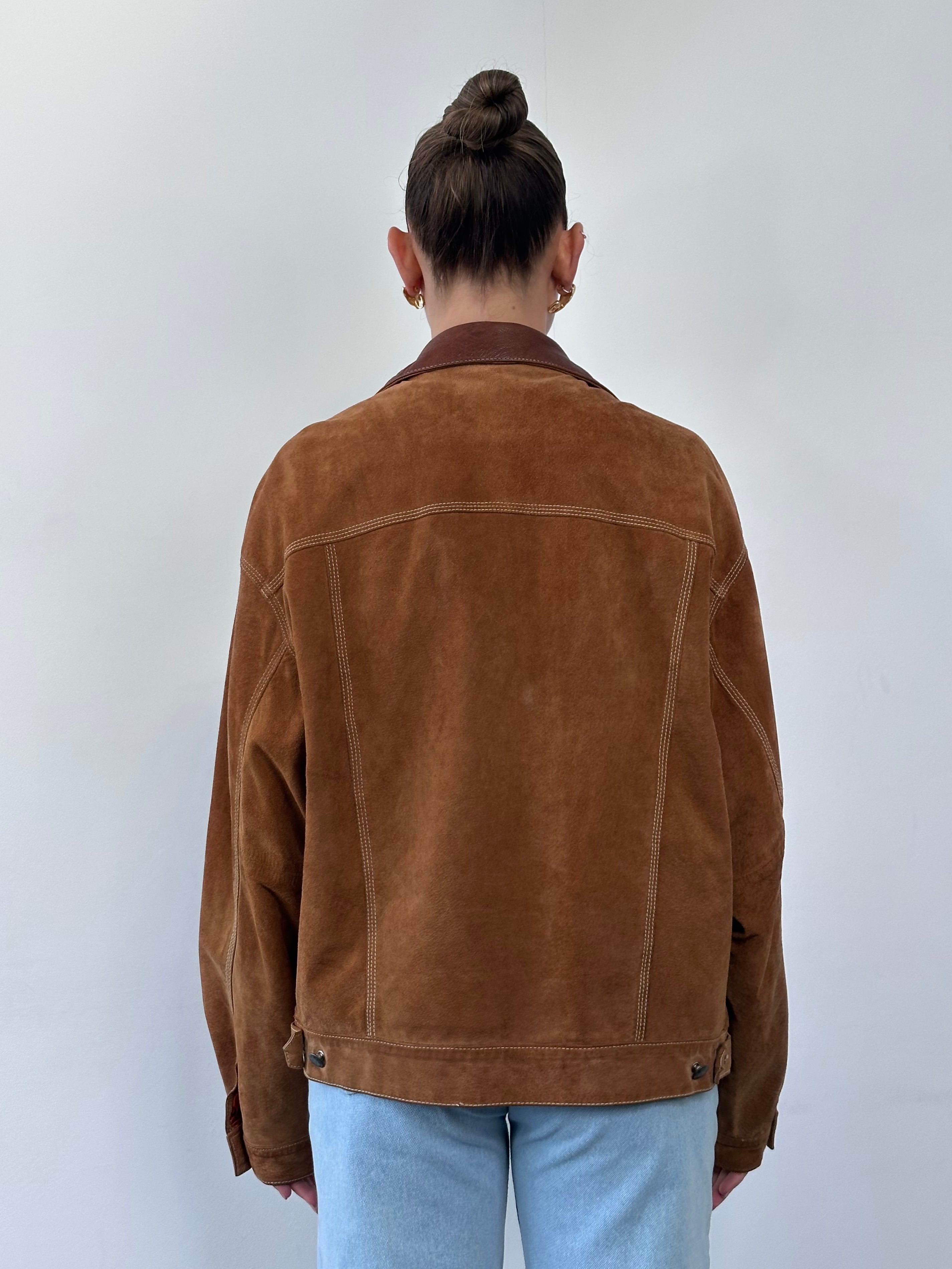 Avirex suede trucker jacket in size large, featuring a classic design with suede material and detailed stitching.