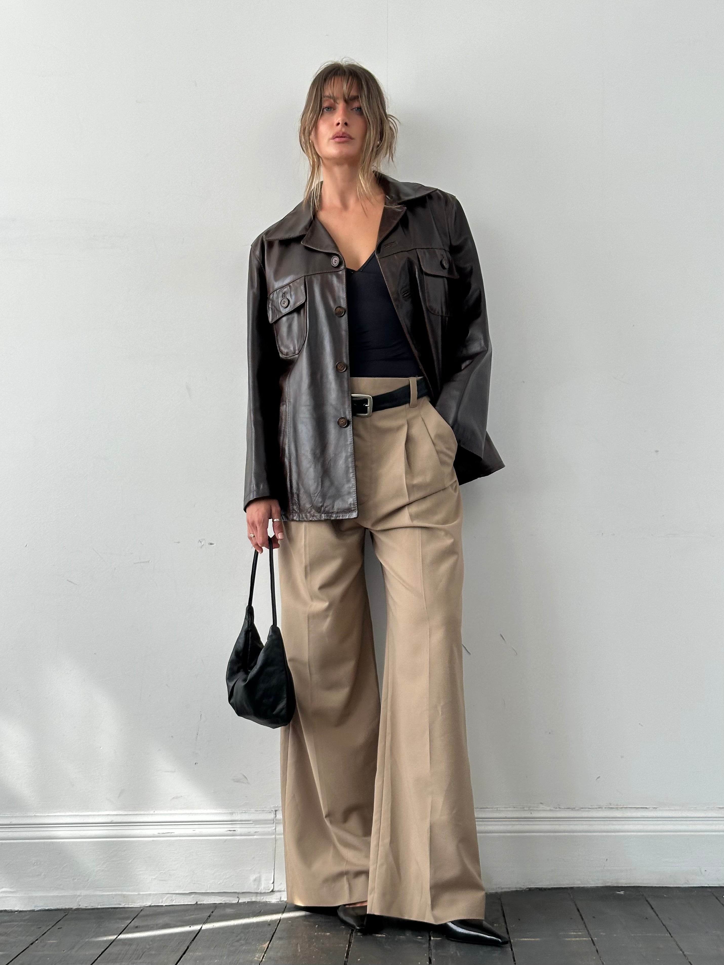 Conbipel boxy leather jacket in size L, featuring a stylish cut and smooth leather texture, displayed on a hanger.