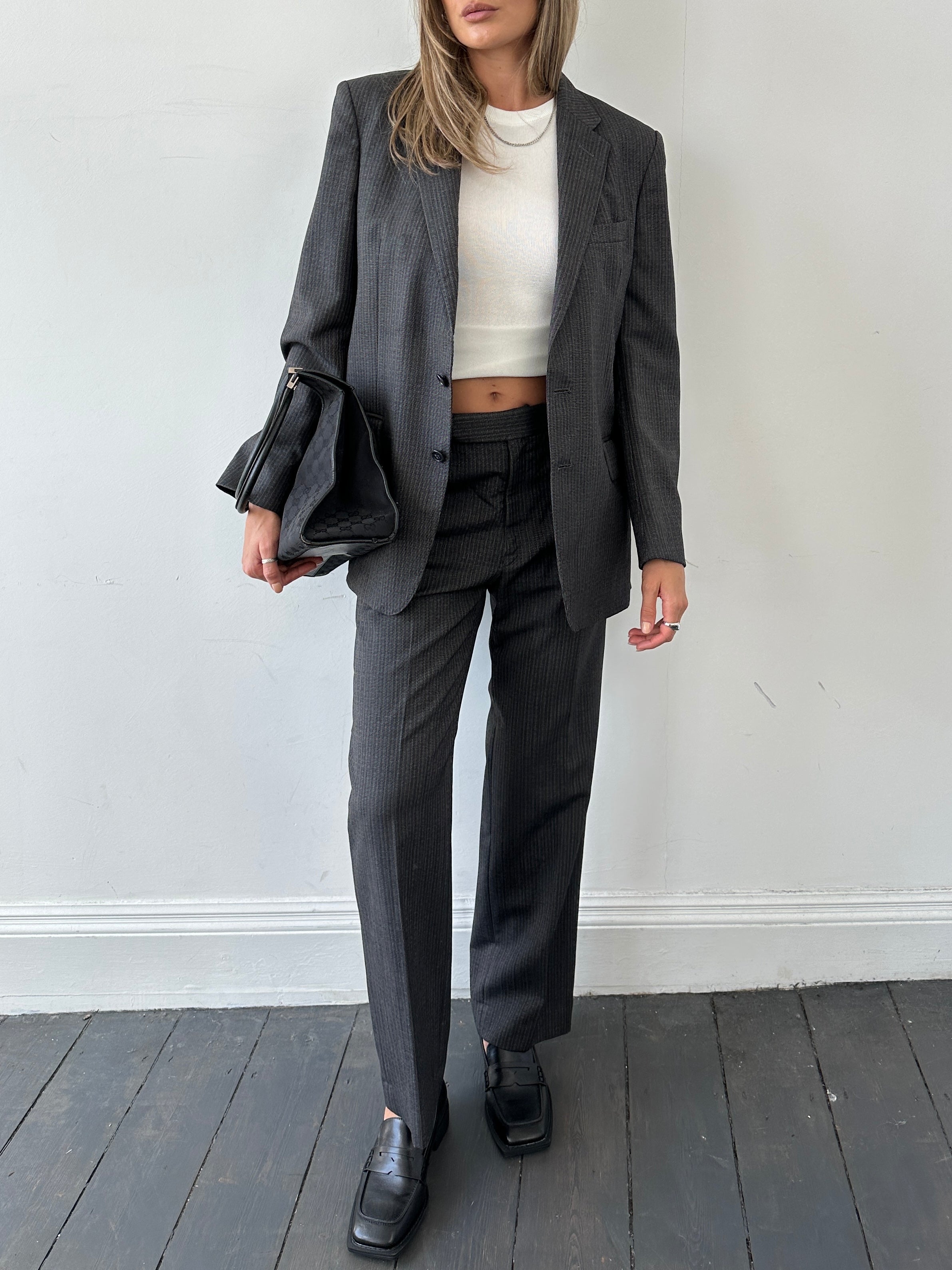 Christian Dior pinstripe single-breasted pure wool suit jumpsuit, size 40R/W32, featuring tailored lapels and a sleek fit.