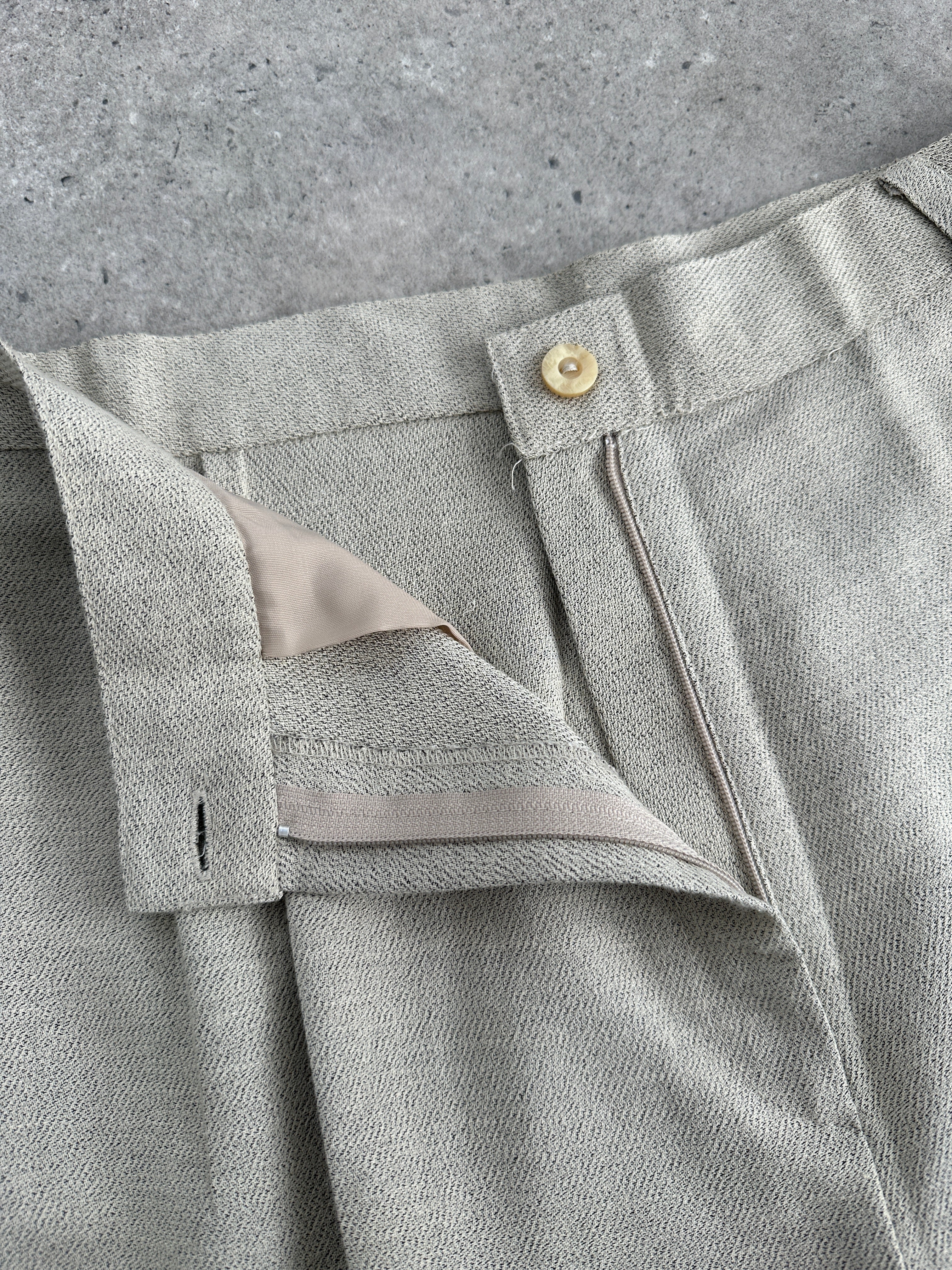 Vintage Italian vintage high waist tapered leg tailored trousers in classic fabric, showing front view with belt loops and tailored fit.