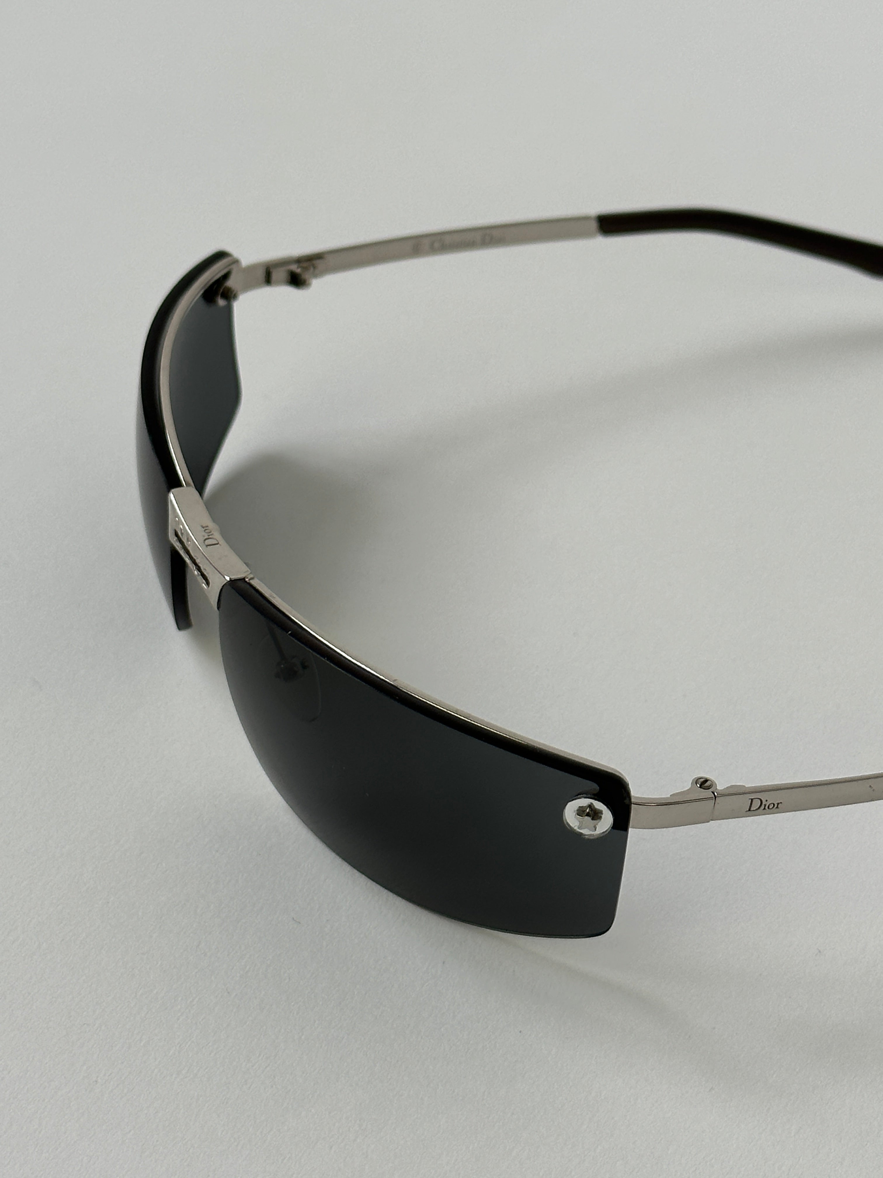 Christian Dior 2000s rimless sunglasses with sleek design and tinted lenses, stylish and lightweight eyewear.