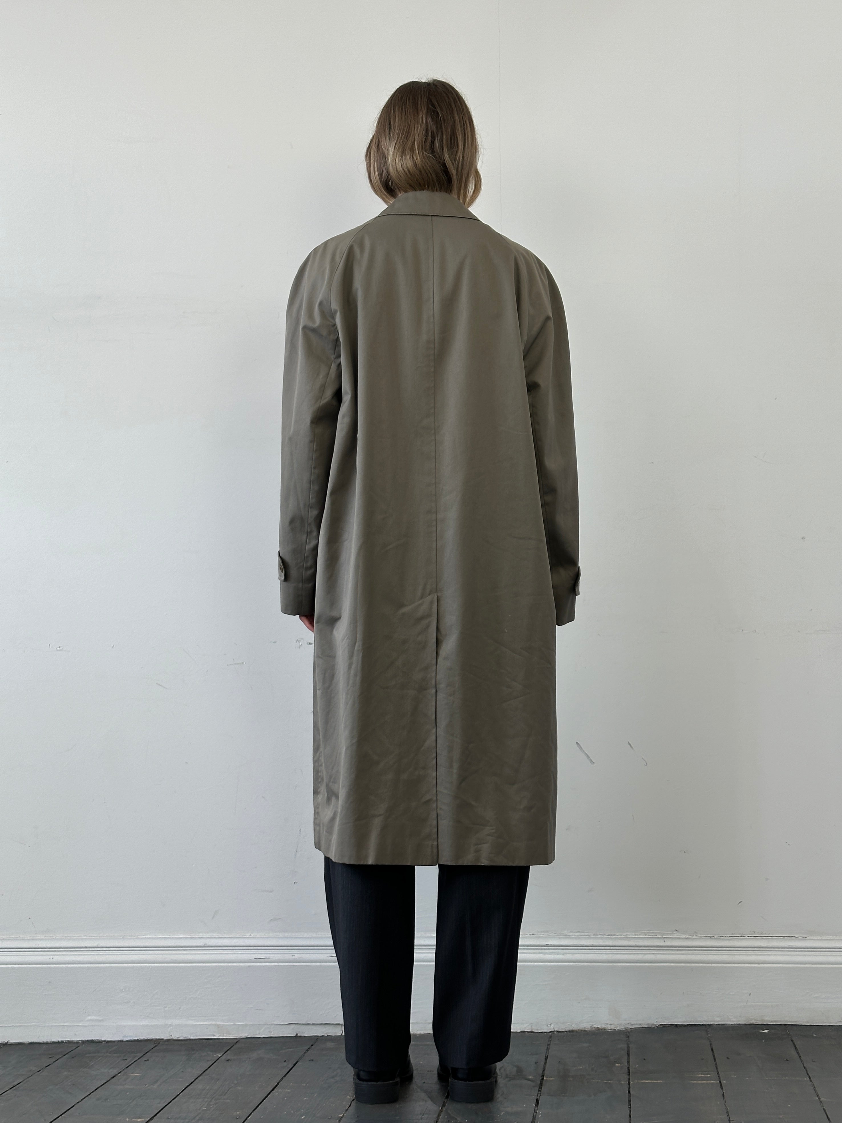 Aquascutum cotton trench coat with concealed placket in XL size, classic beige color, tailored design, and waterproof fabric.