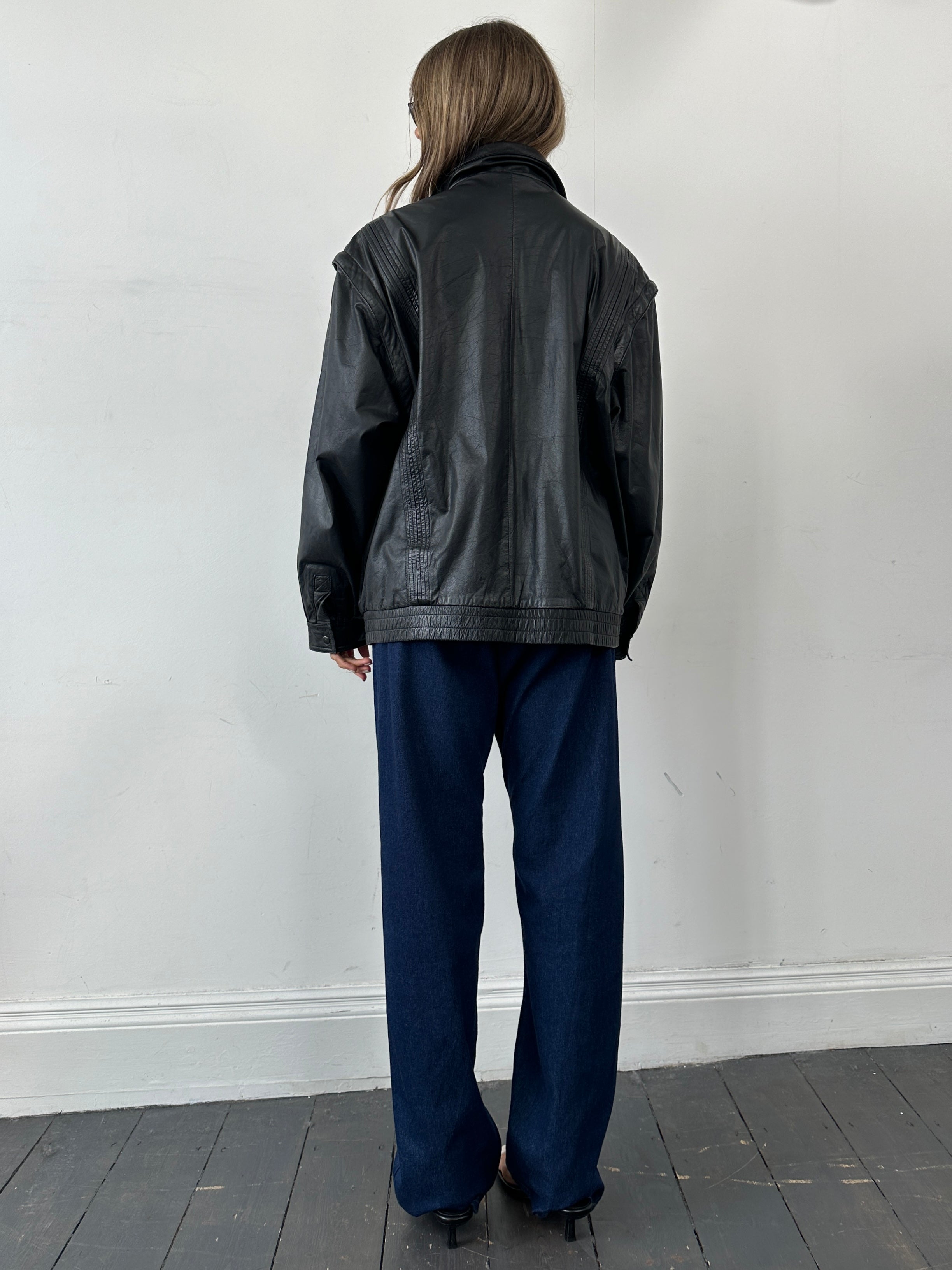 Vintage leather bomber gilet jacket in XL, featuring classic design and rugged texture, perfect for a stylish layered look.