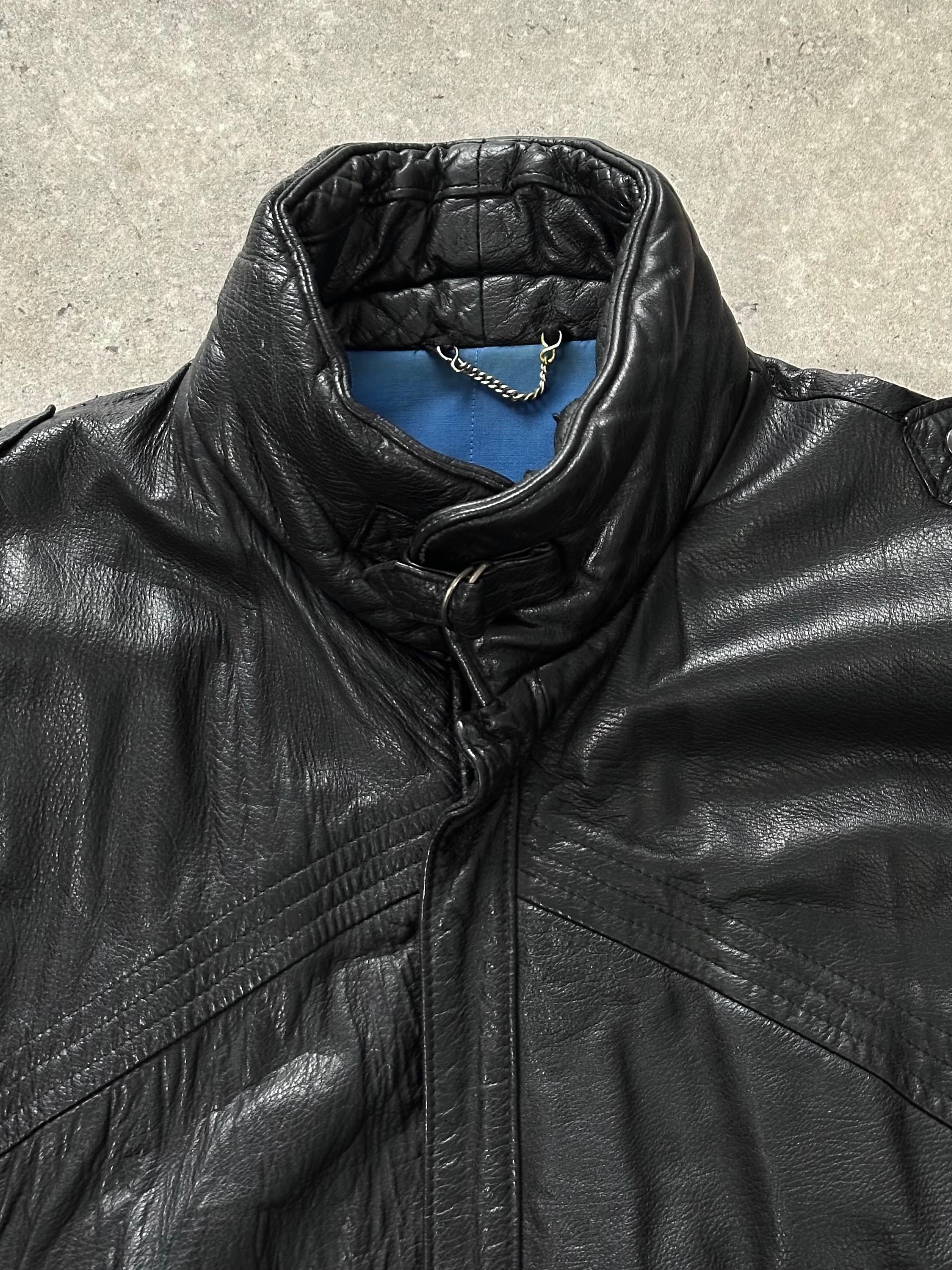 St Michael 1980s high neck leather bomber jacket in XL, black with front zipper and ribbed cuffs, displayed on a hanger.