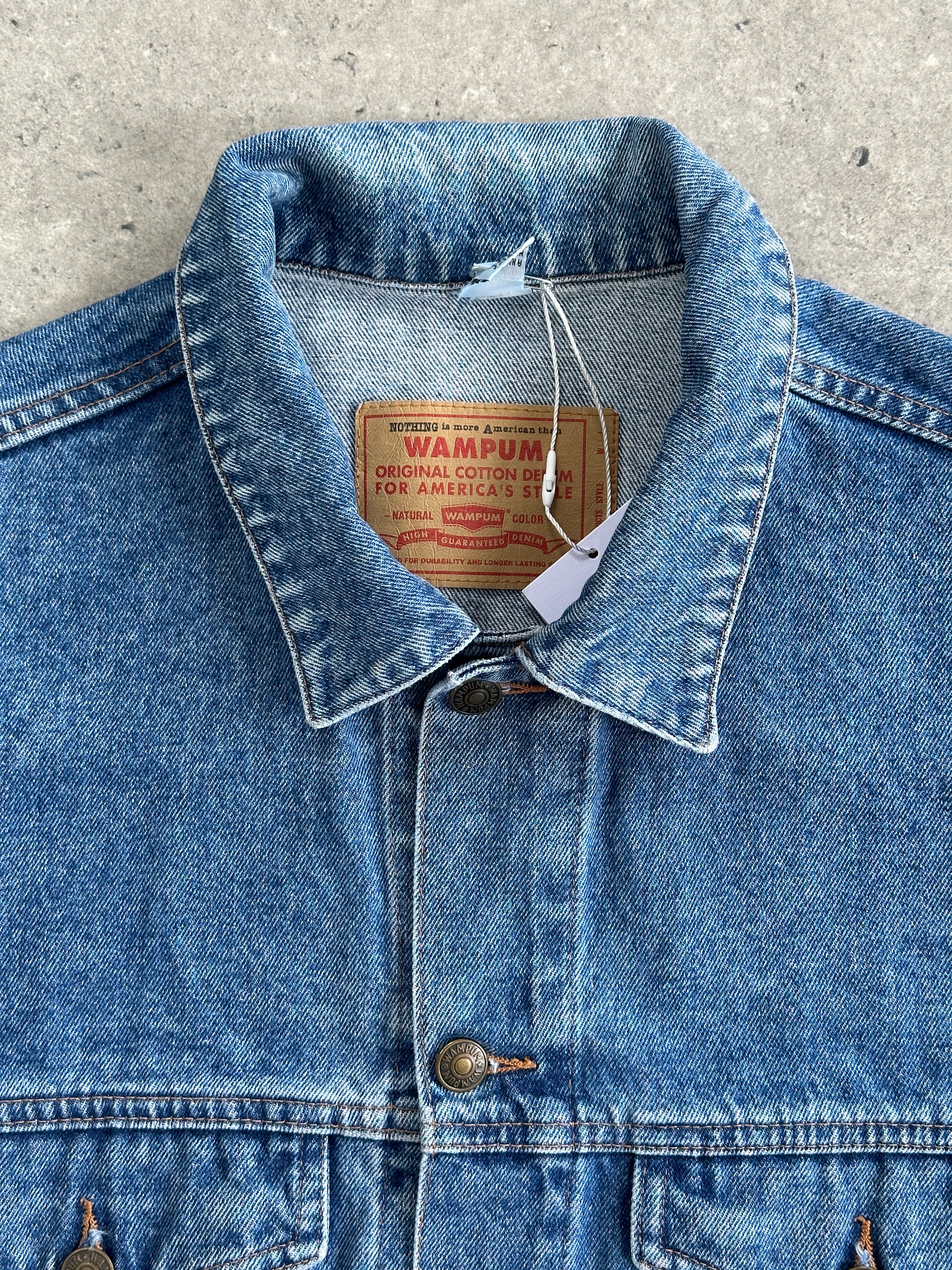 Vintage oversized pure cotton denim jacket in XL, front view showing classic blue denim and relaxed fit.